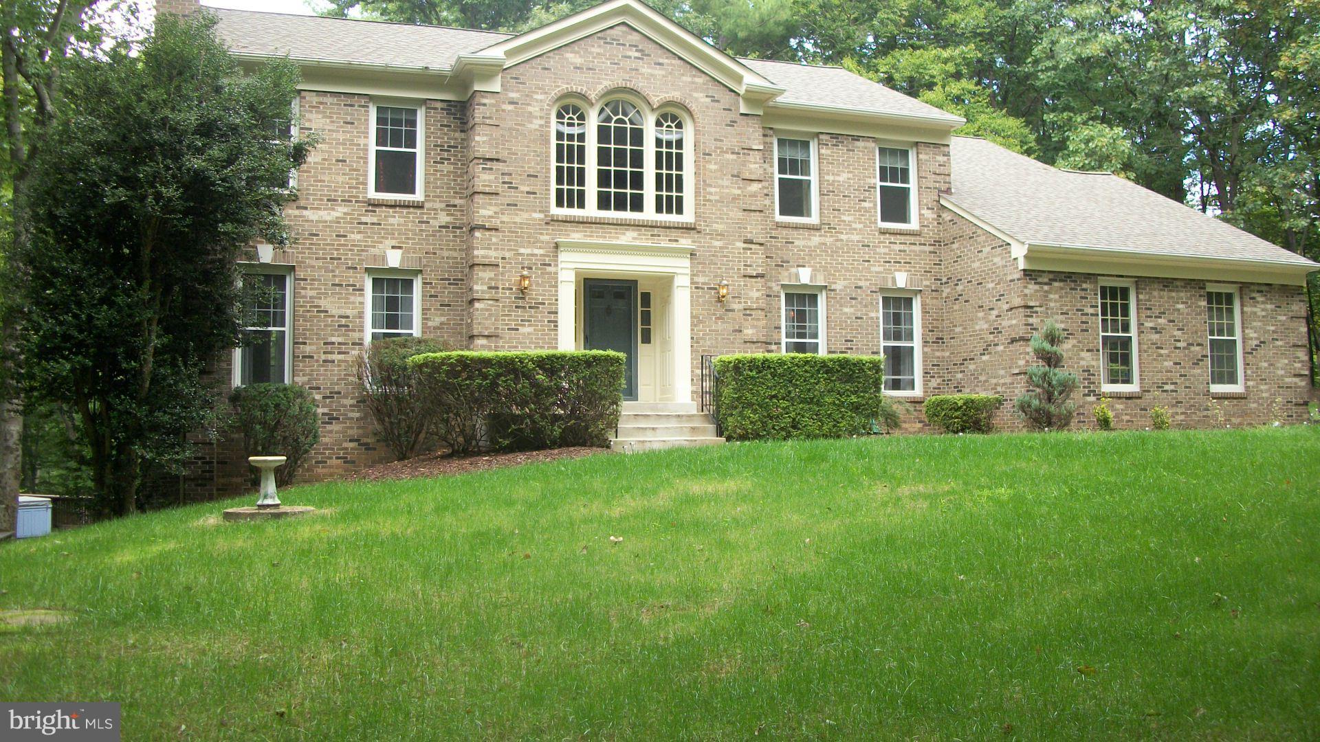 PRICE DROP 5Acres of PRIVACY. Heated In-Ground Pool w/sep Hot Tub. Oasis in the Woods! HUGE 4+ Bedrooms. BRICK front. Storage everywhere. BIG closets. Mast Bed wit Sitting Rm & Dressing RM. Hardwoods on Main. Garden Window in Kitchen. Multi Decks across back. FULL finished walkout L/L with 3rd FP , Media Room & Bath. Shed/shop w/full power. Largest usable yard in neighborhood. Mid County Location.