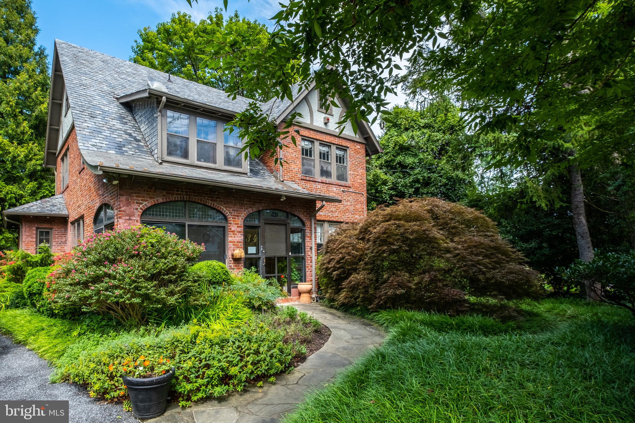 Utterly charming and surprisingly spacious with all the warmth and comfort of a country home, 3415 Cummings Lane is located just minutes to DC in the Martins Addition neighborhood of Chevy Chase.  This lovely, understated house sits on a large lot with a gorgeous outdoor pool and is surrounded by trees.  The entry sunroom with terra-cotta tiles and garden views at every angle makes this home particularly welcoming.  Living room and dining room are spacious and elegant.  The gourmet kitchen is a chef's dream and the family room, with multiple doors to the pool and garden, is the perfect place to entertain or enjoy with family.  The second level has three cheerful bedrooms all with en-suite baths. The third level has a private and cozy home office or guest suite with full bath.  The lower level is finished and ideal for game night, watching ball games or enoying a little quiet time.  The garden is amazing with plenty of room for sports, entertaining and gardening.  Pool, garage and a location that is perfect - two blocks to the Brookville shops and less than one mile to the DC line and all that the City has to offer.  A very special house in a lush and tranquil setting.    Open Sunday 2-4 pm