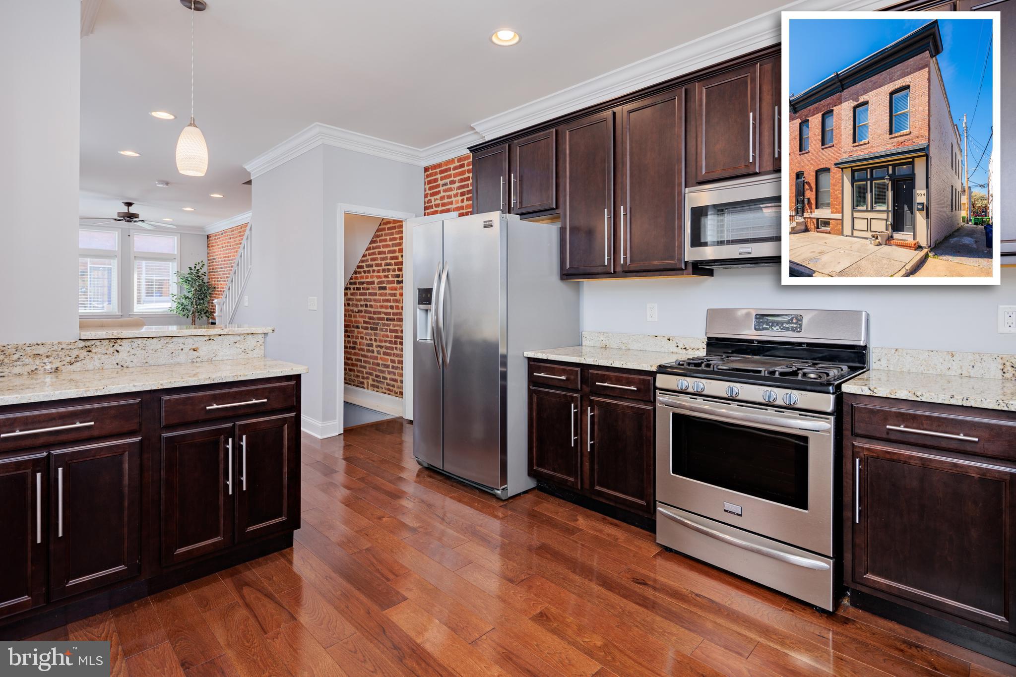 3 Bedrooms 3 Bathroom Canton rowhome with private parking pad! Open floor plan, hardwood floors, exposed brick, crown molding, granite counters, eat-in breakfast bar and many more upgrades throughout. Upper level features two bedrooms each with their own private bath. Two tier rooftop deck with amazing city views! Fully finished basement with space for living/office area, bedroom and full bath. Steps away from Paterson Park and walking distance to Canton bars, restaurants and shopping! Seller will make no repairs.