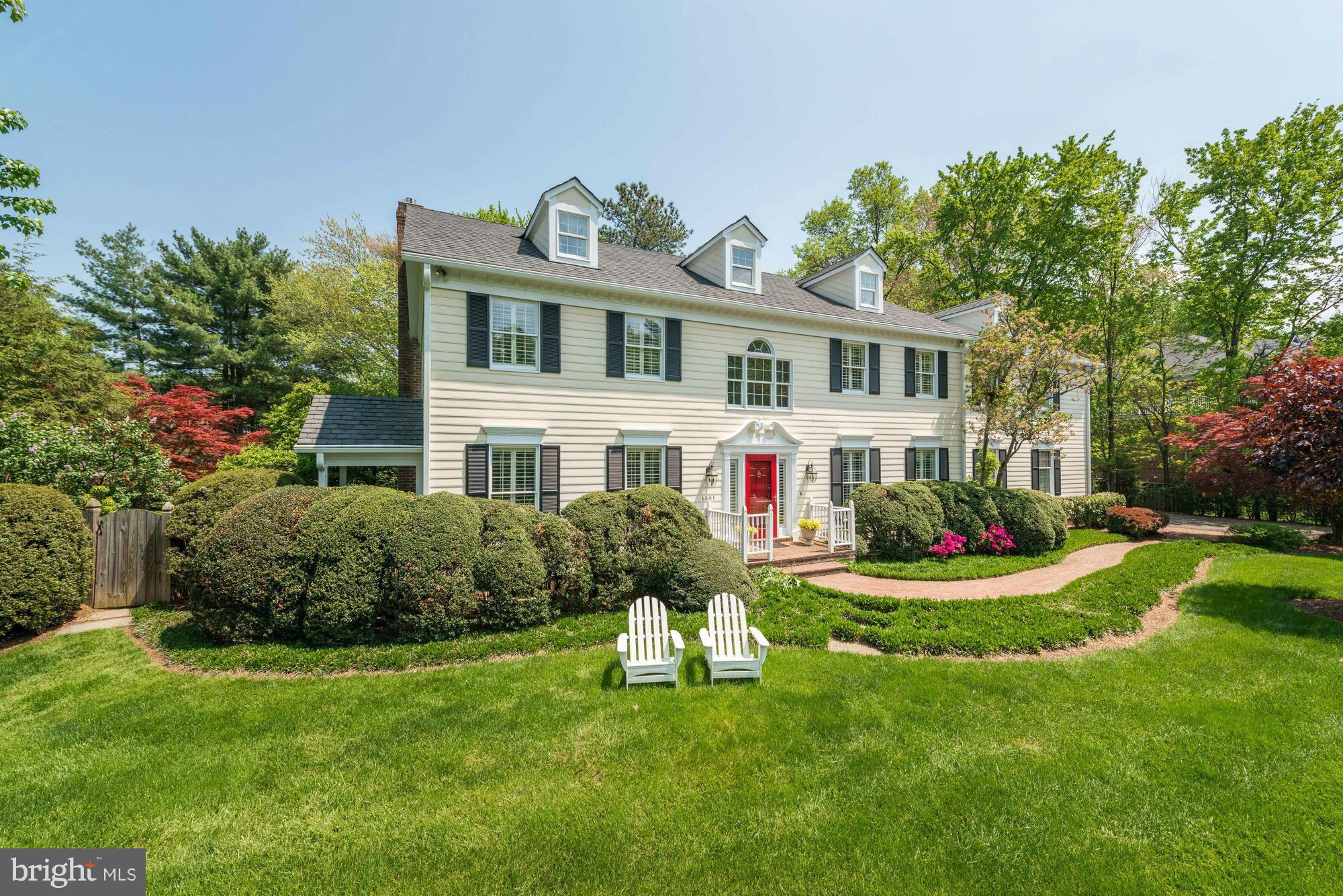 New England colonial in Summerwood! Perfectly sited on .83 acre lot w/incredible pool, gardens, screen porch