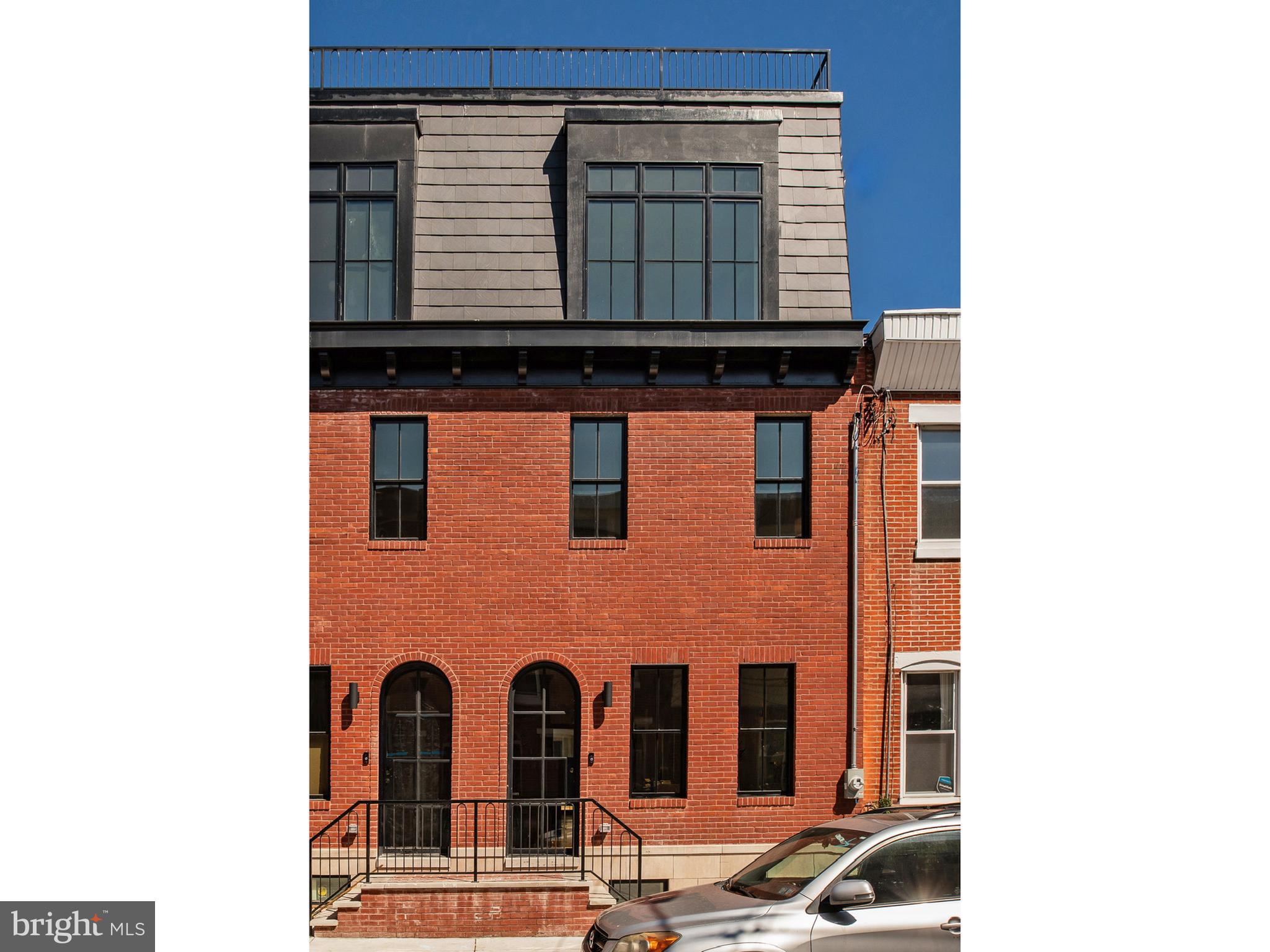 Introducing 1921 Montrose Street, an urban oasis in the heart of Philadelphia. This fully renovated, modern 4-bedroom, 3.5-bathroom home spans 2,730 finished square feet, and offers a luxurious retreat in a vibrant neighborhood. It’s conveniently located within walking distance to both the Schuylkill Banks and Rittenhouse Square, and within the Marian Anderson Elementary Catchment.

Step through an arched front steel door and rebuilt facade, into a very stylish living level that has a generous amount of space for lounging and dining, as well as a powder room and fabulous kitchen. The kitchen includes a long central island, bar area, thoughtfully designed cabinetry, and high end appliances. Seating along one side of the kitchen island is ideal for casual dining, food prep, and entertaining. In the rear of the first floor, glass doors provide fantastic daylight in the kitchen and lead outside to a private back patio.

Downstairs, the fully finished basement includes a media room/den, a full bathroom, and an additional bedroom, complete with heated floors for added comfort.

Ascending to the second floor, you’ll find two bedrooms with carefully designed closets, large windows, and a large full bath that includes a double vanity, soaking tub, and shower. A laundry closet equipped with a washer and dryer is conveniently located in the 2nd-floor hallway.

The third floor is dedicated to the primary owner's suite, and features a spacious bedroom, a large walk-in closet, and a remarkable wet room with a double vanity, stall shower, and a soaking tub. An additional room on the 3rd floor offers flexibility for an office or a quiet retreat. With an adjacent closet, this can also serve as a fifth bedroom.

Up the stairs to the roof level is an indoor wet bar that leads outside to an expansive outdoor roof deck with captivating views and the structural requirements and connections for a hot tub, creating the perfect setting for entertaining or unwinding.

The home is adorned with modern Moroccan notes and authentic materials such as Zia tile, Cle tile, white oak, cement tile, and Tadelakt treatment in the bathrooms, showcasing exquisite craftsmanship and attention to detail. Large windows provide abundant natural light in the home, and natural hardwood floors run throughout.

Located on a quiet, tree-lined street, this home is the epitome of urban sophistication. A fully rehabbed property with this much style and quality is a rare find, and it comes with a 10 Year Tax Abatement. Don't miss the chance to make 1921 Montrose Street your urban sanctuary. Schedule a showing today!