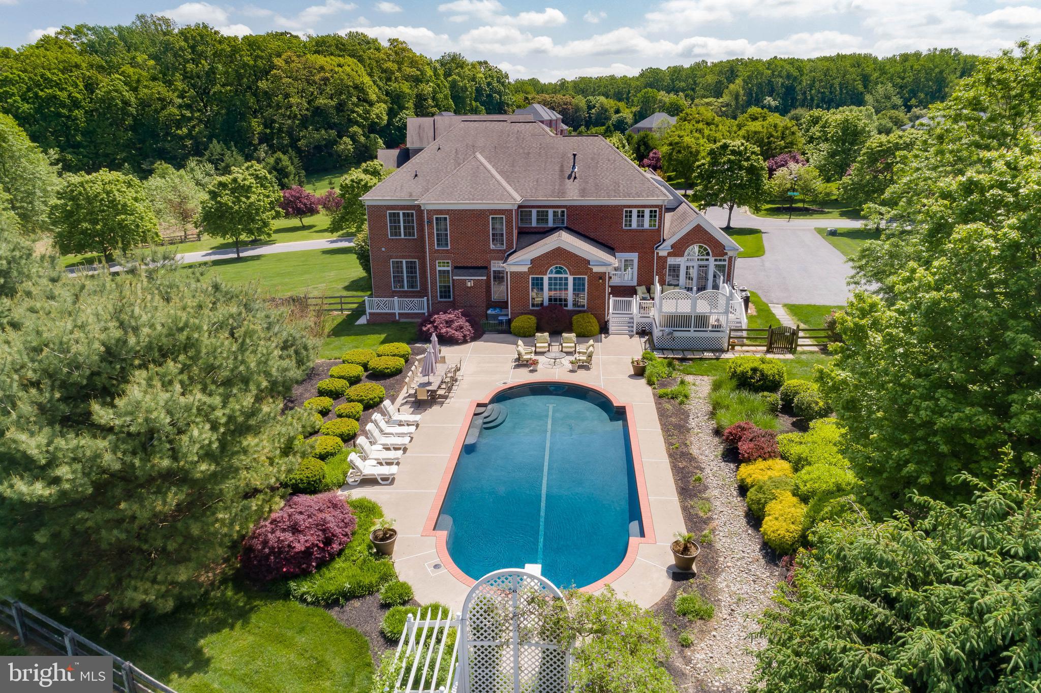Live authentically. Stunning interiors designed by Melisa Marcus. A clean, airy, uplifting palette permeate your being. An inviting breath of fresh air. Dive into your tranquil pool which beckons for splashing all summer long. Immense multi tiered outdoor living is ready to host friends and family in all seasons. Gorgeous cooking space with  Plain & Fancy Custom Cabinetry...  strong blue and white aesthetic... as timeless as it is modern. Long lines of sight connect everyone for a supremely livable floor plan. Well conceived spaces that are as functional as they are sumptuous... explore the art of lounging in every one of them. A dining room that sets the scene for the ultimate dinner party. Indugent owner's suite with fireplace sitting area and luxe bath streamlines your morning routine. Finished lower level. Pool was recemeted and new tiles and coping were installed in June 2024. Pool is not heated. Pool has built in seating in the shallow and deep end. Pool is serviced by Lothorian. Verizon Fios Internet. Cultivate your existence. The art of uniting human and home.