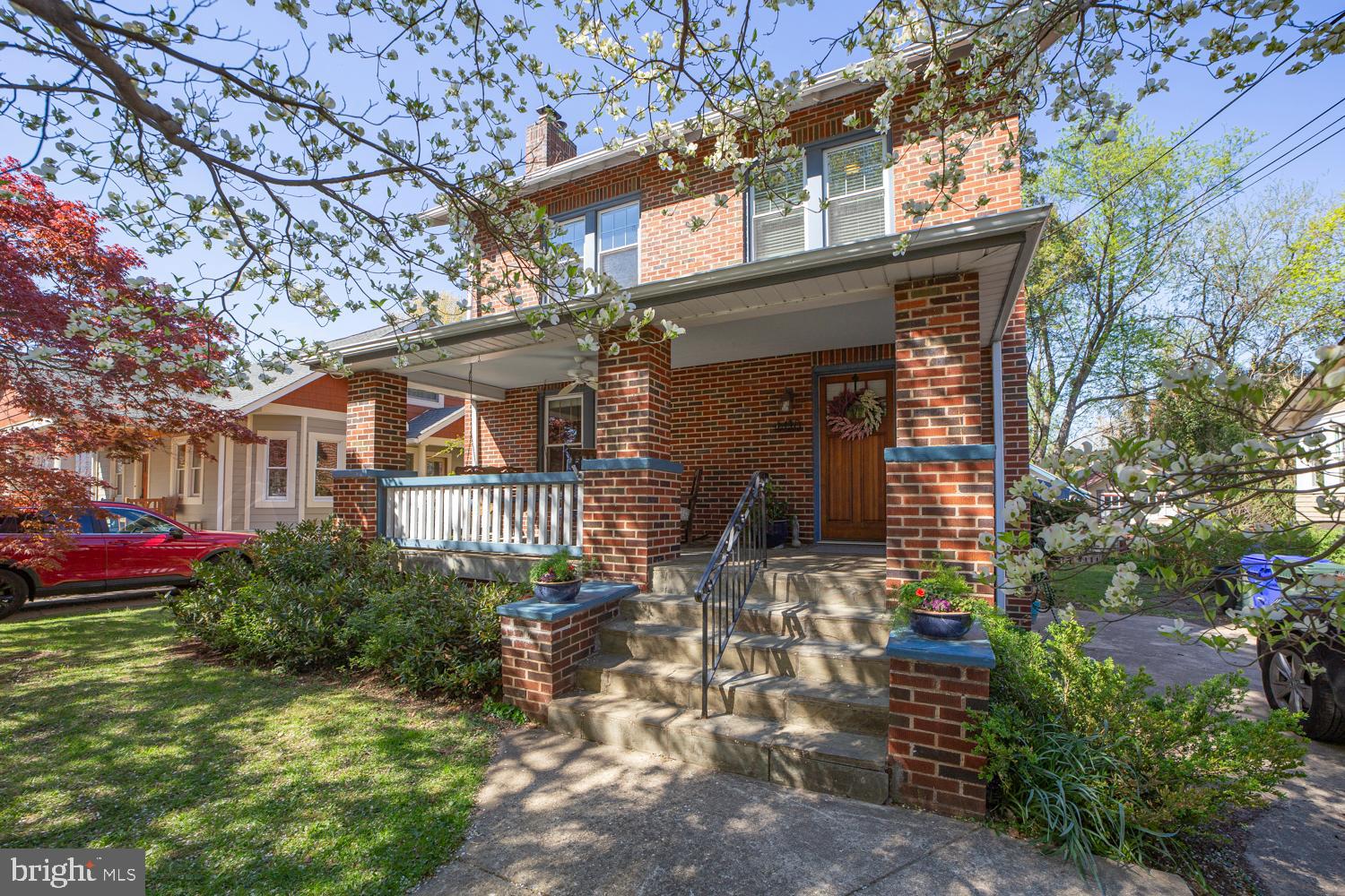 This is the one people wait for in University Park—a classic Colonial with presence, a true front porch, and a layout that just works.  The porch sets the tone: wide, welcoming, and connected to the neighborhood.
The fully renovated, spacious kitchen is fully open to the dining room and is designed for real life. Quartz countertops, stainless steel appliances, a large island, pantry storage, recessed lighting, and a skylight create a bright, functional centerpiece that flows directly into the dining area.

Hardwood floors, natural wood details, and a wood-burning fireplace add warmth and character. Step from the kitchen onto a spacious rear deck overlooking a fully fenced yard—ideal for entertaining, gardening, or unwinding.

Upstairs offers three bedrooms plus a bonus attic room for office, play, or fitness. The lower level adds a fourth bedroom, full bath, and recreation room for guests or flexible living.

Major systems are in place, including a high-quality furnace, tankless water heater, and whole-house filtration.

Less than a mile to the Metro and close to neighborhood favorites, all within the strong community setting of University Park—tree-lined streets, active civic life, and everyday convenience.