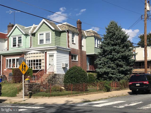 Great opportunity for some sweat equity in this unbelievable uniquely large home .   A previous attorney residence and office addition which now has endless possibilities for either a 5 bedroom home ( in law suite potential ) or home with separate office , or potentially a 2 family ( multi- family ) property with proper approved zoning .   End of  row , front , side  fenced yards  . Car port with cement driveway on the side .  Front porch .  Enter into a large den with deco fireplace , slate flooring and paneled walls . Formal living room with carpets  and large bay window , formal dining room with carpets , large window and Juliet balcony .  Straight through design rear eat in kitchen with electric range . Steps and door exit from kitchen to a huge roof deck - yes roof deck . 2nd floor features rear bedroom with carpets and long closet .  Middle bedroom with carpets , hall bath , primary bedroom with carpets and ceiling fan . Basement ( walk out level )  has front laundry room , side door exit , heating closet ,  powder room in large family room . Step up to former "lobby" waiting room or den with side door to car port . 2 former " offices" or bedrooms . Come and see the potential yourself . This property will not last . Sellers looking for  "as is"  sale .  Property is dated and priced accordingly .
