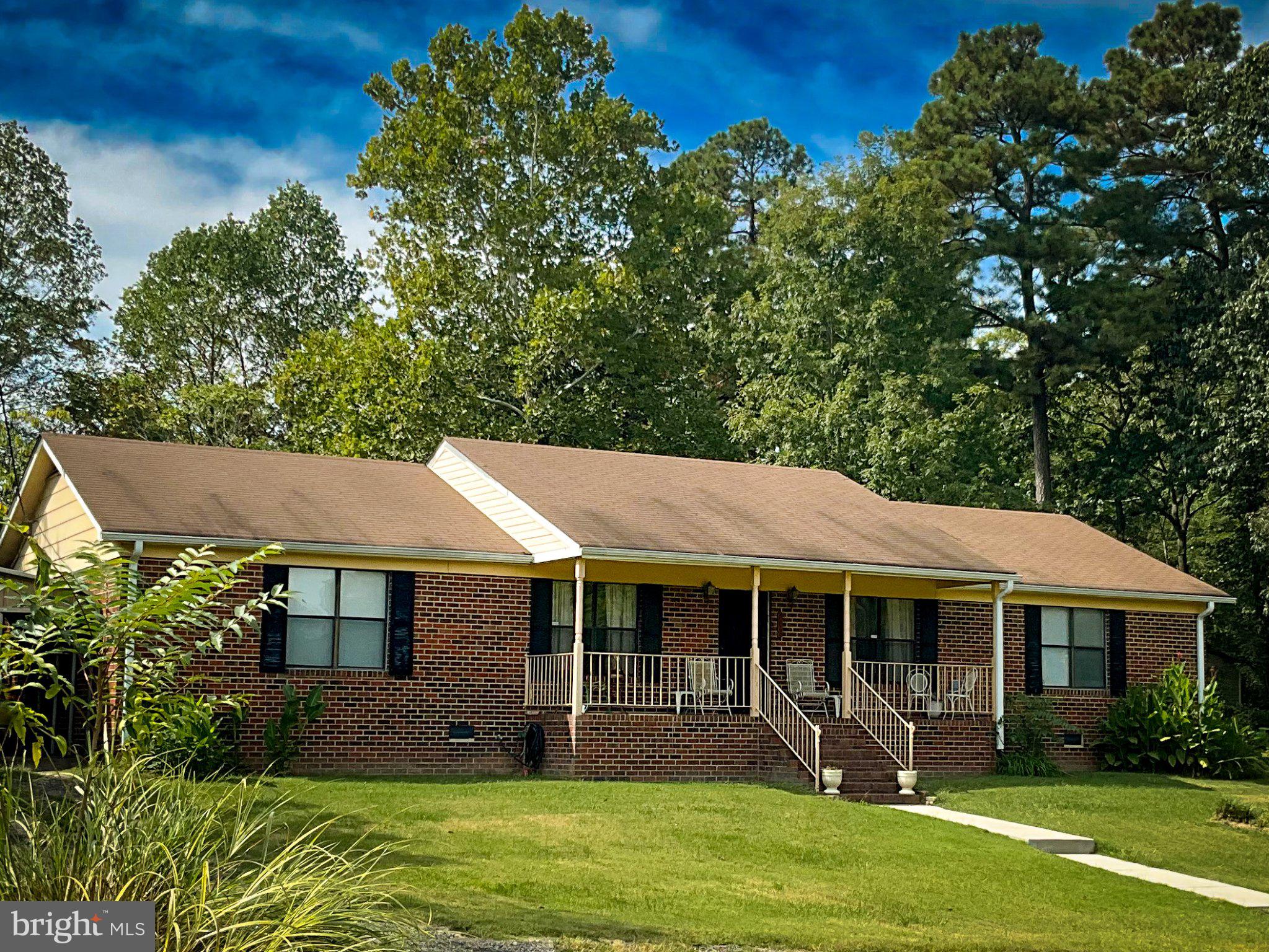 A classic all-brick rambler on almost an acre of land is designed for comfort and functionality, with classic curb appeal and plenty of outdoor space.

Inside, You will enter the foyer of a functional layout featuring formal living and dining rooms.  Flowing into an open kitchen/family room design with upgraded cabinets and countertops,  hardwood floors, brick fireplace, and sliding doors that open to a spacious deck and patio overlooking the backyard perfect for gatherings, big or small.  The primary suite includes its own private bath, while two additional bedrooms and a second full bath.   To complete the floor plan with a 3rd Entrance to a mud room combined laundry room.

Outdoors, the property features an adjacent carport, garage, storage shed and custom built grill— the expansive lot provides endless opportunities  from gardening and outdoor dining to simply enjoying the peace and privacy of  a huge open front lawn, mature trees, deck and brick patio provide plenty of space for grilling, gardening, or simply enjoying peaceful evenings.

Conveniently located along James Madison Parkway, this home offers easy access to Dahlgren, Fredericksburg, and Southern Maryland while still providing privacy and space. A great opportunity for anyone looking to add personal touches and make it their own.