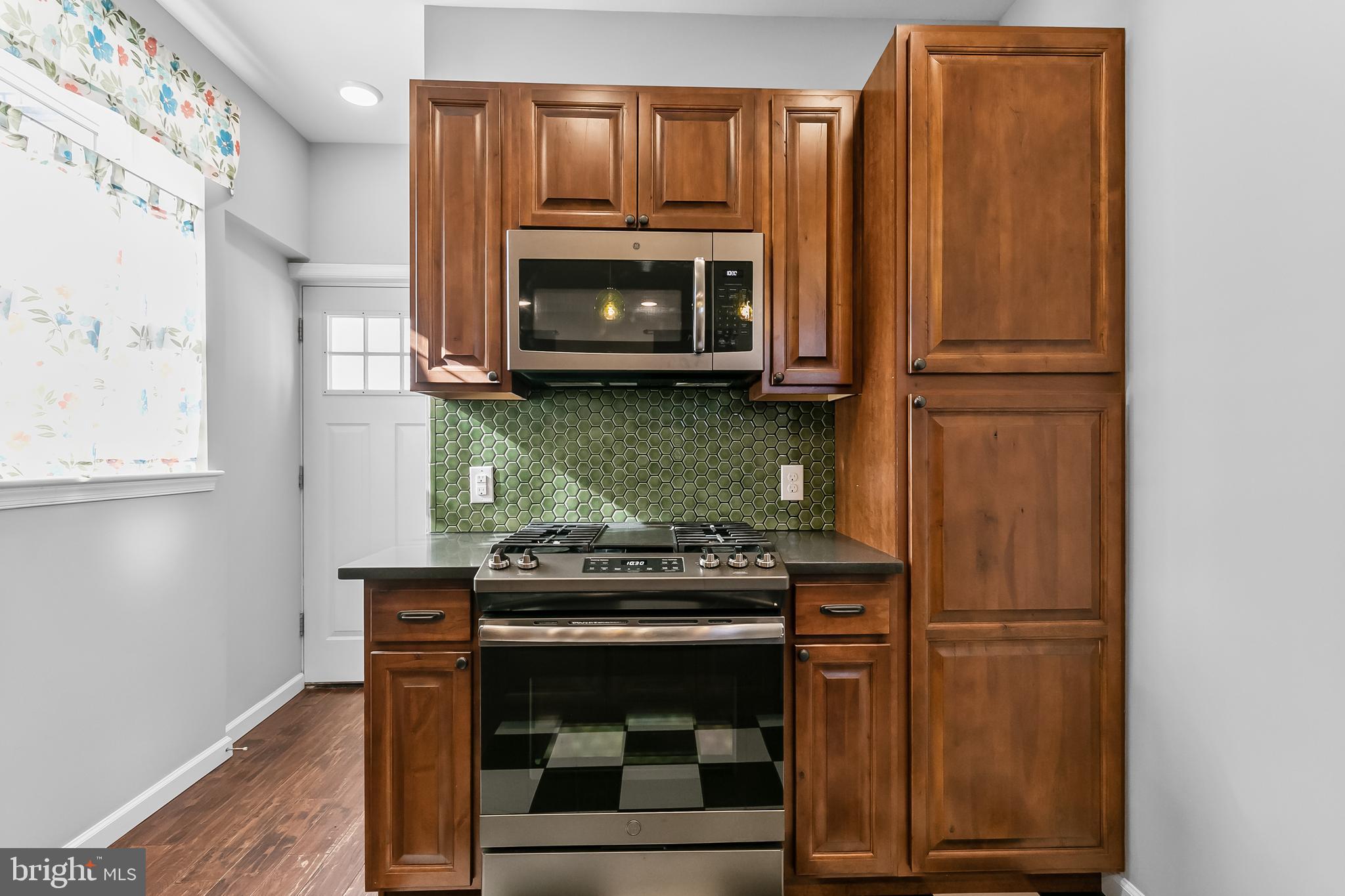 Here is your fantastic opportunity to rent a perfectly updated and lovingly customized home in booming Northern Liberties—available NOW for immediate move-in! The first floor has an open concept living area with warm wood floors. The gorgeous kitchen features wood cabinetry with plenty of storage, stainless steel appliances and a modern tile backsplash. There’s a small yard out back, and an unfinished basement down below for storage. Up on the 2nd floor you’ll find a large bedroom with custom closets, bathroom with full size washer and dryer, plus an open den area perfect for working from home, working out, making art, doing yoga etc. so many options with a flex space. The third floor has a whole suite; large bedroom, lovely, updated bathroom, custom walk-in closet and a fabulous roof deck giving you a private oasis to relax. Pets considered on a case-by-case basis, easy online application. Schedule a tour and start packing!
