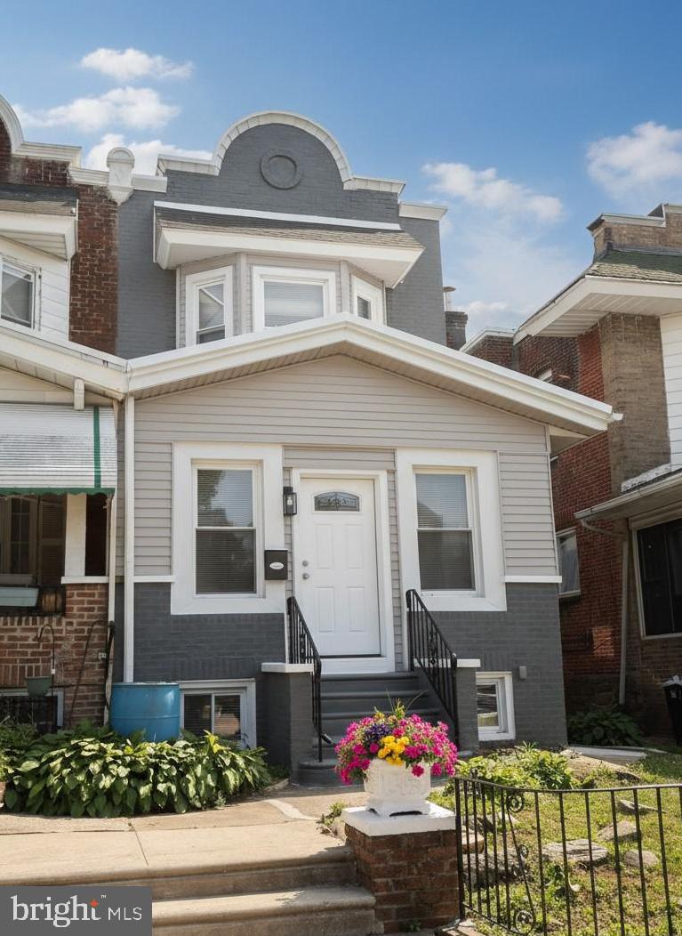 Welcome to 6134 Washington Avenue—an exceptional, 2700+ sqft, fully renovated home in one of West Philadelphia’s most desirable neighborhoods. Rebuilt from top to bottom with all new plumbing and electrical, this stunning property seamlessly blends timeless character with modern luxury.

Step inside through the spacious foyer, highlighted by a beautiful modern chandelier, and immediately feel the scale of this impressive home. The first floor offers an enormous open-concept layout with soaring ceilings, recessed lighting throughout, and an abundance of natural sunlight. Original architectural charm has been thoughtfully preserved, including gorgeous stained-glass windows and the home’s beautifully restored main staircase.

The luxury kitchen was designed with both style and function in mind, featuring stainless steel appliances, gas cooking, an oversized breakfast bar, elegant stone backsplash, and exceptional cabinet/storage space. The adjoining dining area easily accommodates a large table—perfect for everyday living and entertaining.

Just off the rear of the home, enjoy a raised covered porch ideal for relaxing, overlooking a spacious enclosed backyard—an incredible bonus for the area.

The fully finished basement expands the living space even further and offers endless possibilities with a huge flex room perfect for a game room, media room, playroom, or man cave. This level also includes a large bedroom and a beautifully appointed full bathroom featuring luxury tile finishes.

Upstairs, you’ll find generously sized bedrooms with high ceilings and continued natural light throughout. The primary suite is a true retreat with a spa-inspired ensuite bathroom featuring a dual vanity and high-end finishes reminiscent of a five-star hotel. The hall bathroom is equally impressive with premium tilework and upscale design. Every shower throughout the home includes luxury multi-directional spray systems for a truly elevated experience.

A major added convenience: second-floor laundry.

This is a rare opportunity to own a beautifully restored and thoughtfully upgraded home offering size, style, and premium finishes throughout—all in a prime Philadelphia location.

Fully renovated. Exceptionally spacious. Move-in ready.
