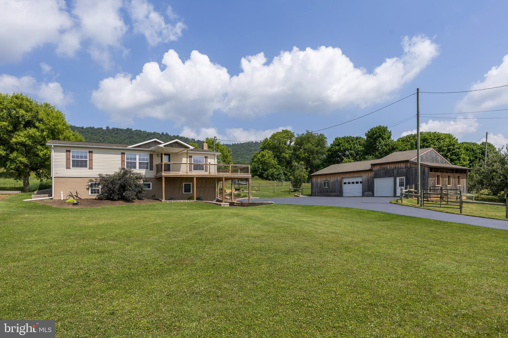 OPEN HOUSE - Thursday, July 2nd , 4:30 - 6:00 PM
Welcome to 2893 Jacksonville Road! Nestled on 0.87 acres, this beautifully updated 3-bedroom, 2-bath home offers the perfect blend of comfort, functionality, and country charm. Recent improvements include new drywall, flooring, paint, and a brand-new roof installed in 2026.
Enjoy the outdoors from the spacious front deck, installed in 2024, and the rear deck added in 2022, providing the perfect space to relax and take in the surrounding views. 
The property also features versatile outbuildings. The refinished and enclosed barn with three stalls is ideal for hobby farming, animals, equipment storage, or workshop space and is complemented by a chicken coop and electric fencing, making it well-suited for those looking to keep livestock or poultry. In addition, the 30' x 32' detached garage has been updated with a refreshed exterior and provides ample room for vehicles, tools, recreational equipment, and more.
Situated on a permanent foundation with a full, unfinished basement, this move-in-ready home offers abundant storage and endless potential for future expansion. Thoughtfully updated throughout and featuring central air, it provides the space, flexibility, and peaceful rural setting you’ve been looking for. Don’t miss the opportunity to make it your own!