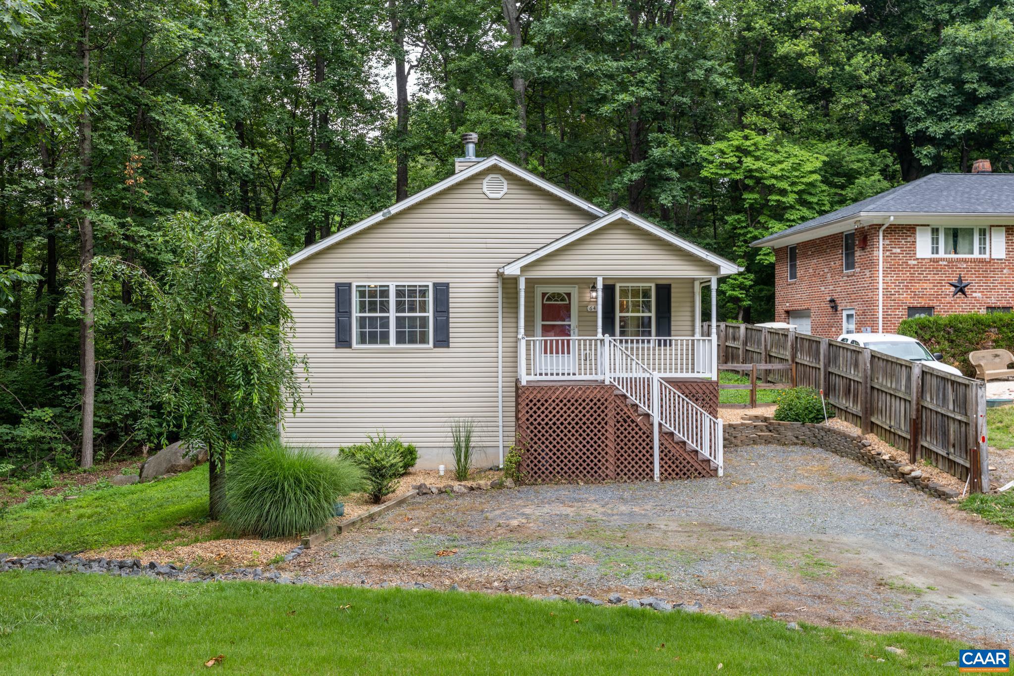 Welcome to this charming 1-story rancher in Louisa's desirable Blue Ridge Shores subdivision! Built in 2007, this 1,400-square-foot home offers convenient single-level living with 3 bedrooms and 2 full bathrooms. The spacious open kitchen showcases a custom backsplash and flows seamlessly into the dining and living areas, creating the perfect space for everyday living and entertaining. Relax in the generously sized primary suite featuring a luxurious jacuzzi tub, or unwind by the cozy wood-burning fireplace. Outside, you'll find a fully fenced backyard and dual porches, ideal for enjoying the outdoors. Additional highlights include low-maintenance vinyl siding, a gravel driveway, high-speed fiber internet, and a brand-new water heater installed in 2026. Located in the sought-after Blue Ridge Shores community, residents enjoy exceptional amenities including lake access, a marina, tennis courts, walking trails, with the annual HOA fee covering both trash pickup and road maintenance. This home has been pre-inspected for added peace of mind, is priced below its appraised value, and is vacant for immediate occupancy with easy showing availability. Don't miss this incredible opportunity?schedule your private tour today!