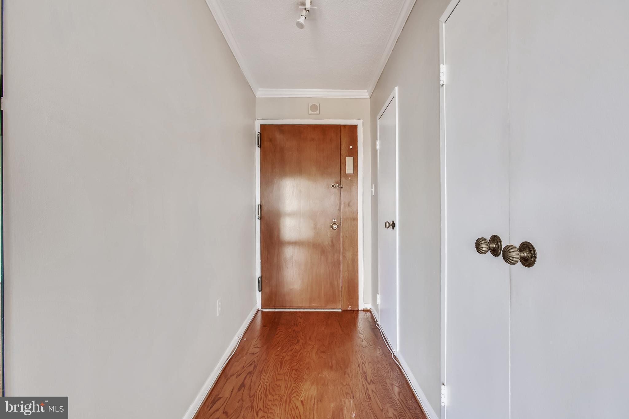 Stylish, renovated condo in sought after Alexandria House.  This unit -with a spacious primary suite -offers sweeping views of the City and the Potomac River as it faces north.  The freshly refinished floors sparkle through out from the minute you step inside.  The kitchen features bright  white shaker style cabinets, quartz counters and all new appliances.  You'll be delighted to find that there is space for a table in the kitchen as well.  The open living and dining room space is perfect  for both daily living and gathering with friends and family.   There is access to the expansive balcony from both the living and bedroom areas. Both the full and half bath have been renovated with new vanities and fixtures.  Convenient location with easy access to both the Metro and commuter routes.   Many amenities are close by- Trader Joe's and Harris Teeter are just a block away along with local shops and restaurants.