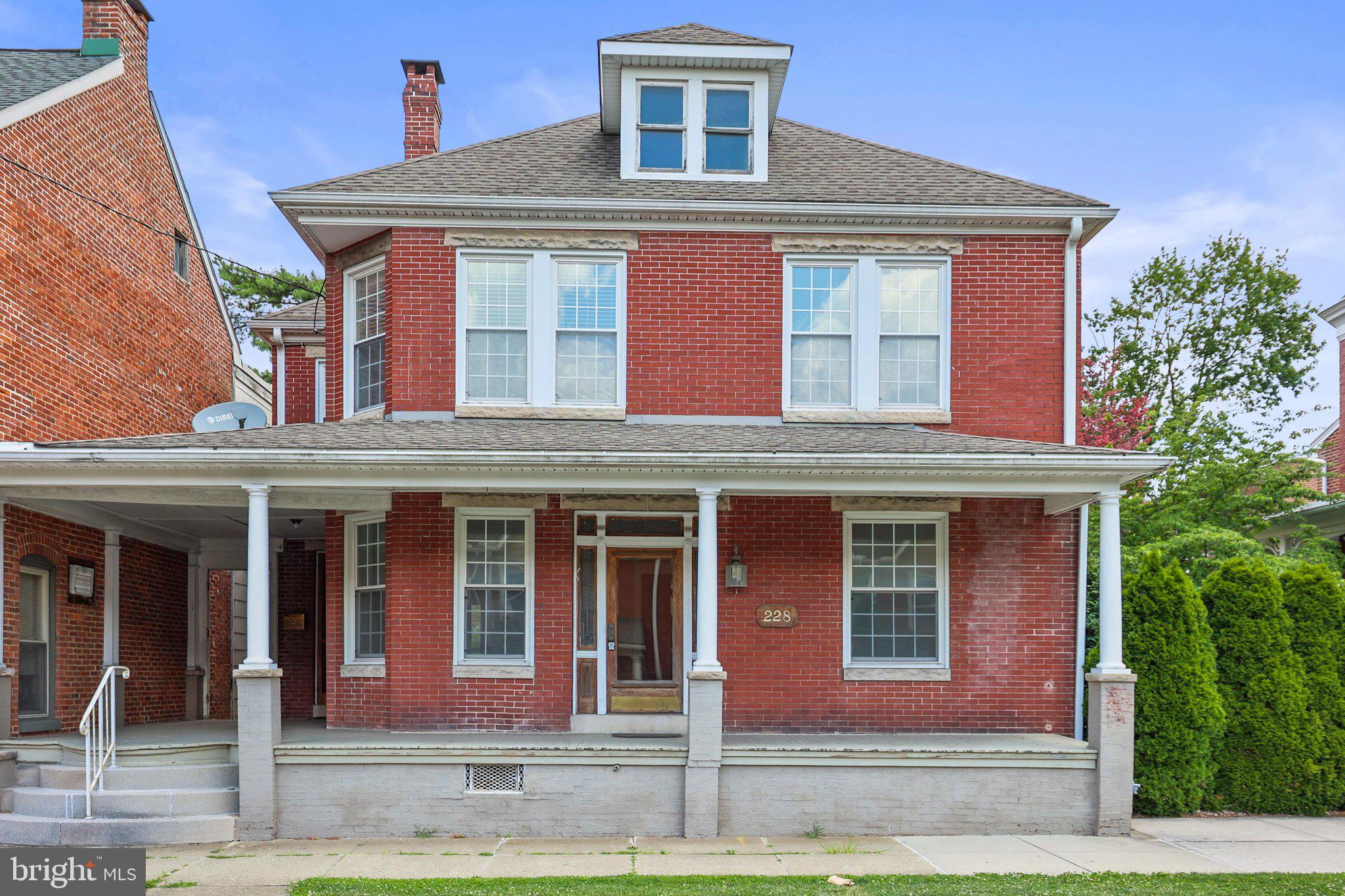 Classic Brick Colonial with Endless Possibilities! This solid home offers exceptional flexibility with five rooms on the main level that can be configured to suit your needs, including a first-floor bedroom, home office, den, playroom, or additional living space. Upstairs, you'll find four bedrooms, a full bath, and the convenience of a second-floor laundry area. A full walk-up attic and full basement with outside access provide abundant storage. Comfort and efficiency are enhanced by two gas forced-air furnaces (2023) and two central air conditioning units (2004), separately serving the main and upper level. Additional updates include a hot water heater replaced in November 2025 and a roof installed in 2003. Quality craftsmanship is evident throughout with ornate concrete lintels, hardwood floors, wide window sills, generous closet space, and numerous built-ins. Multiple entrances and Mixed-Use zoning create outstanding opportunities for a professional office, home-based business, retail use, or other permitted uses. Situated on a large, level lot, this property offers the space and versatility to accommodate a wide variety of residential and business needs.