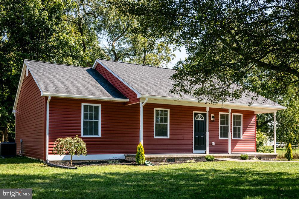 Completely remodeled in 2024 with a cottage feel featuring luxury vinyl flooring throughout, open living room and kitchen with beautiful whitecabinets/countertop, breakfast bar and vaulted ceiling! Vaulted primary bedroom with walk-in closet and full bath featuring tiled shower! 2 additional bedrooms and 2ndfull bath! Relax on the 32x10 covered rear porch with a good book and cup of coffee! Or, you may want to sit a spell on the covered front porch! This lot featuresenough space for a future attached or detached garage! Convenient to the North Fork of the Shenandoah River, restaurants, Walmart, Food Lion, hardware & auto partsstores and more! Don't miss a chance to see this freshly remodeled home before it's gone!