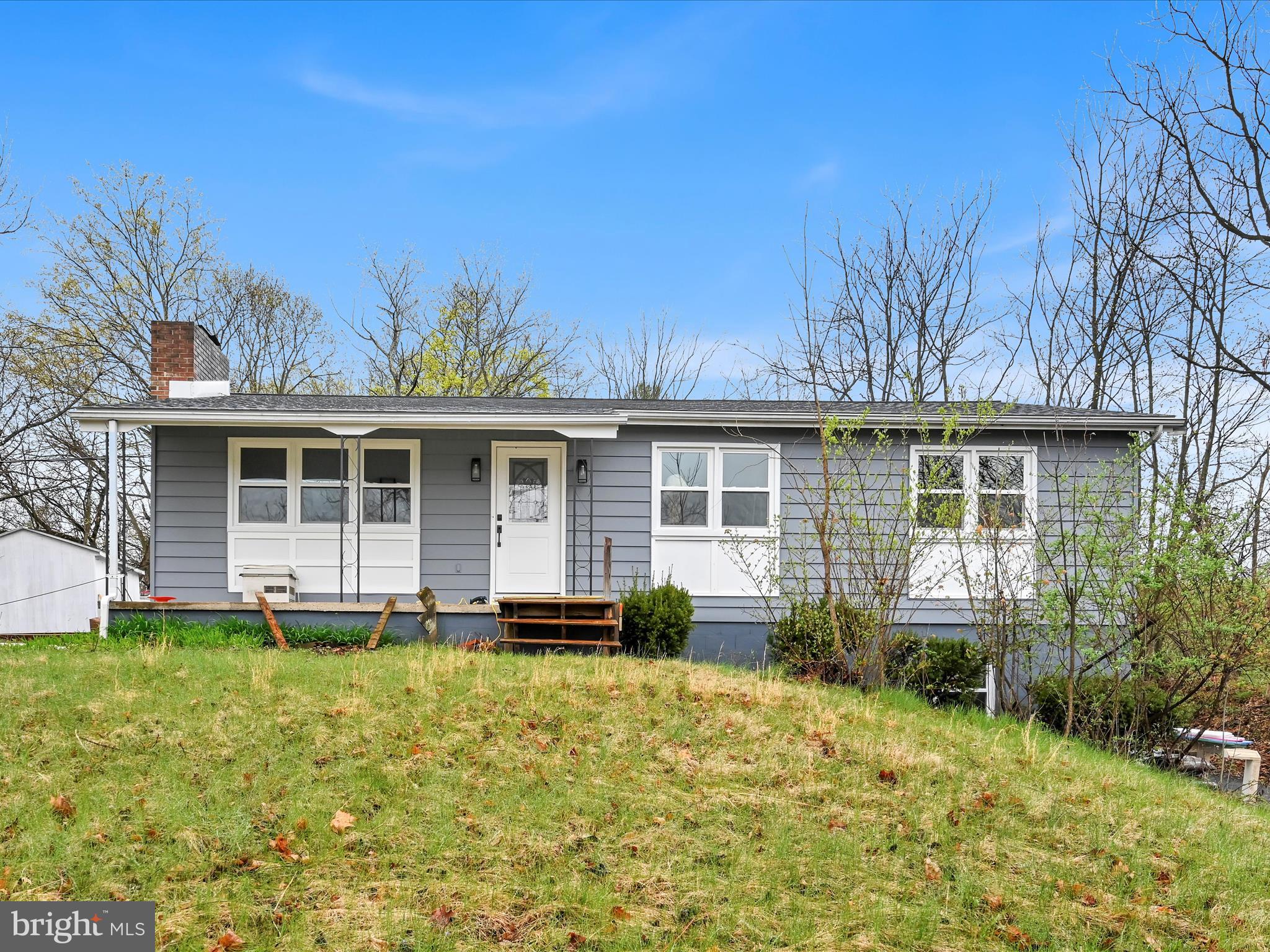 Sunday April 13th,  first showings. Seller doing many renovations to this private location home.Fully finished with  2335 SQ Ft on 2 levels, it  has a handy walk out basement.You enter through the side entrance walk-out  and  through french doors to a finished basement or up and around on this expansive driveway and private, woodsy backyard through an expansive wooden, covered porch. The kitchen has brand new countertops, pantry, and above which are freshly renewed barrel-style cabinets, The stainless steel refrigerator, along with the washer and dryer in the basement, are offered with the sale. 3 good sized bedrooms, and a huge bedroom in the walk-out basement with bath and a large office room. This could be an alternate primary bedroom or guest quarters. The home's evenly heated wth baseboard heating zones.Radon system installed. What a nice, large lot of 8/10acre, the home sit on, and it's across from Daniel Boone elementary school. A half mile from fire co for insurance discount....