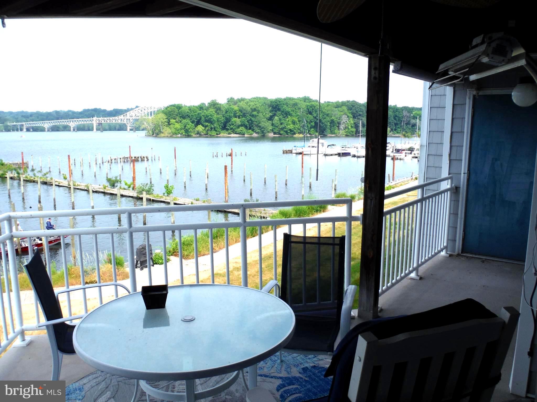 Waterfront Condo with spectacular views of where the Susquehanna River meets the Chesapeake
Bay. Building is the closest to the mouth of the bay providing the best views in the community. Gourmet kitchen includes granite countertops, stainless steel appliances, and breakfast bar. The family room features a gas fireplace and sliders leading to the rear covered private patio with stunning unobstructed water views of the Susquehanna Flats and Havre de Grace. Entertain at your built in balcony bar! The master bedroom also features sliders to the covered patio, with more unobstructed water views, and a large walk-in closet.  Fully furnished optional.  This unit is wider than most units in the community and also features a side window unlike the other units. Conveniently located in the town of Perryville, just minutes from the MARC train, Harford County, I-95, and rte 40. Walking distance to 5th Company Brewery as well as walking path. Boat ramp is $10. Boat slips are available for seasonal rental. Annual pool passes are also available. Waterfront luxury living at its best! Dogs considered on case by case basis. No pit bulls