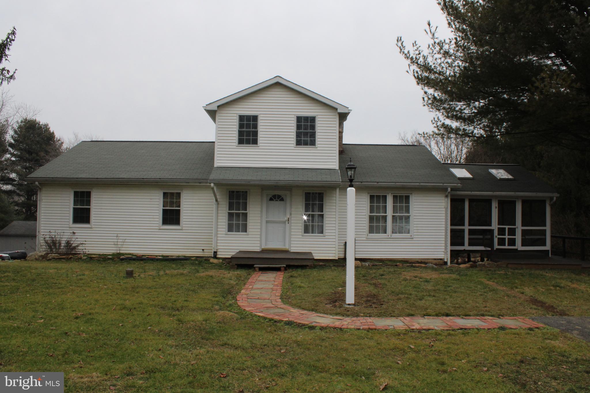 ADORABLE - 4 Bedroom, 2-1/2 Bath house for rent located on 1 ACRE property. Living room w/propane fireplace, spacious kitchen & dining, family room w/cathedral ceiling. 3 Bedrooms, 2 Baths on main floor, 4th Bedroom/office/loft on 2nd floor. Laundry room & half bath in lower level. Propane heat & central air. Landlord will provide lawn care. Available March 15th.