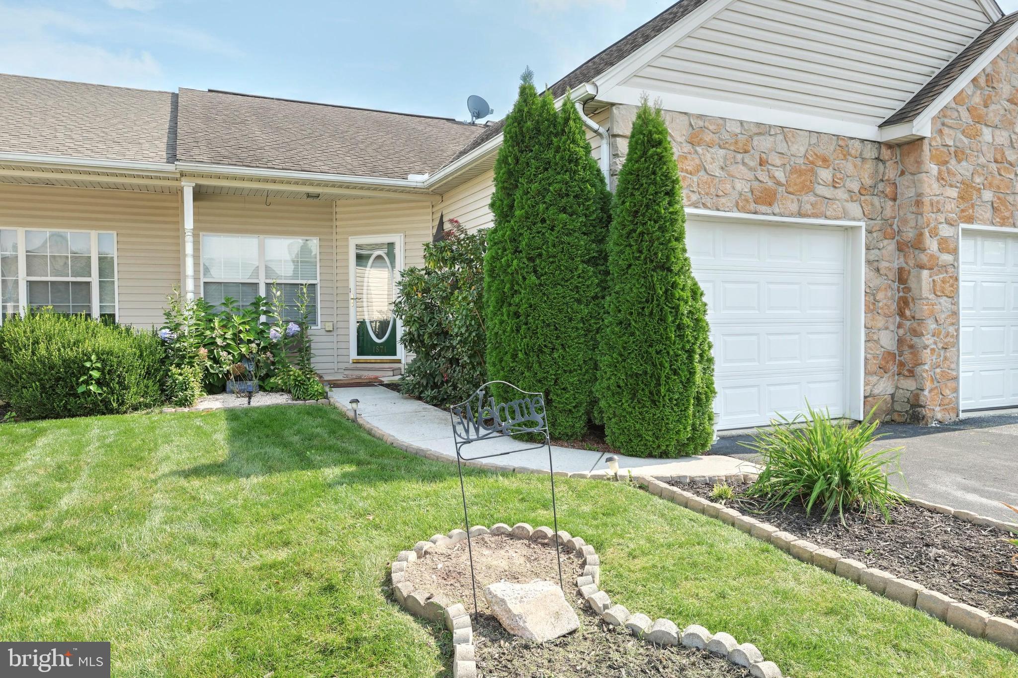Comfortable convenient condo living without giving up the space or amenities!  Main level includes 2 bedrooms, 2 full baths, living room, kitchen, dining room, and laundry.  Open floor plan, hard wood floors, and all appliances included.  Master bath has newer walk in tub with all the bells and whistles.  Fully finished lower level that includes large finished family room,  bedroom #3, and bath #3 with new carpeting that walks out to patio and hot tub.  Enjoy the peaceful back yard area on your deck under the retractable awning, in the hot tub, in the garden, or on the neighborhood walking trail.  This one is a must see!!