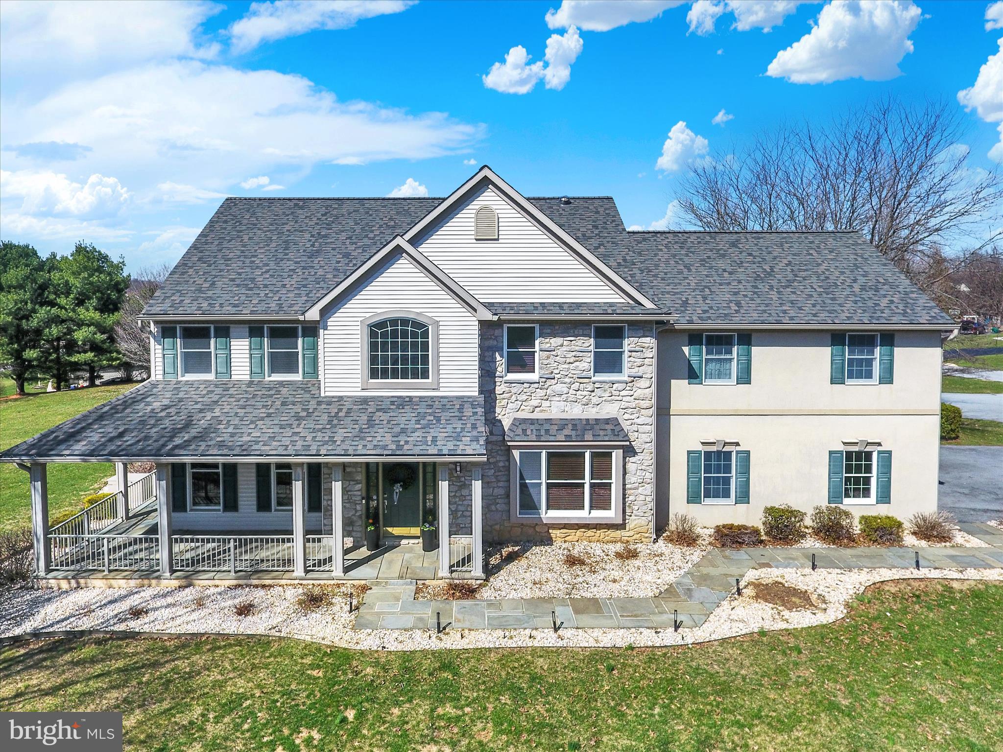 Multigenerational possibilities exist in this truly unique home that offers great style and versatility.  2-Story entrance, formal dining room and reading room/library are just a glimpse of the multiple living areas. The well-appointed kitchen is a chefs dream and boasts a large granite island, gas range and custom wooden cabinets.  Serving as the heart of the home, the kitchen overlooks a large dining area, the great room area and the game day room that's equipped with a wet bar and numerous TV's for your enjoyment.  Doors lead to the extensive back yard area and wrap around porch to enjoy the pleasant surroundings. Upstairs you will find an expansive owners suite with space for a reading nook and desk,  bath with an upgraded high end tile shower and a large spa-like tub. Three more bedrooms and bath complete this area and overlooks the open foyer.  If you want to give guests their own private suite, the bonus room is the 5th bedroom with a full bath and a private entrance .  Once used as an art studio, this area could be used as a gym, dedicated office suite, or a comfortable retreat from stressful days. The lower level is also finished with a game room, and additional flex room for all your creative needs and offers a daylight entrance.  Once outside you will find a thoughtfully hardscaped setting, complete with a firepit, and pavilion -- so simple to relax and unwind.   Additional mentions include a NEW roof,  gas generator, new gutters plus an electric vehicle outlet in the garage. Location is key -- close to Hershey Medical Center, Rts 322, 72, and the PA Turnpike.   Pool, tennis and clubhouse rounds out the carefree amenities available. Call today for your  private showing.