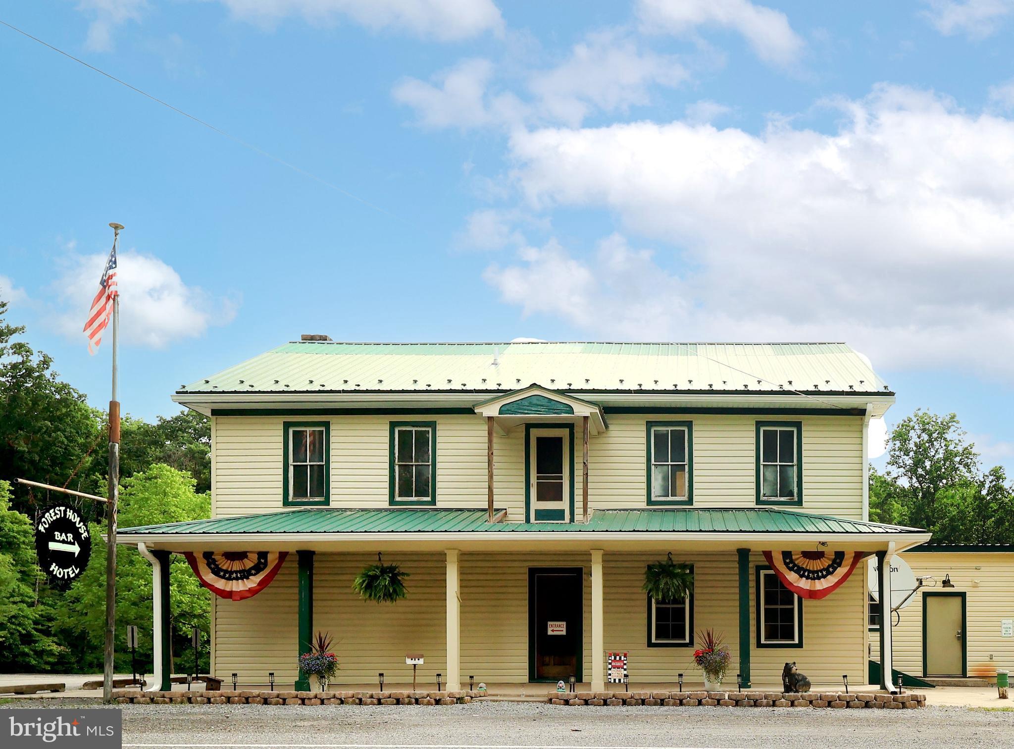 A landmark destination with a rich history in Union County, The Forest House Hotel presents a rare opportunity to own an established restaurant & bar that has welcomed generations of guests. Situated on 2.54 scenic acres with 3 stocked ponds, this iconic property is the only restaurant & bar along Route 192 between Centre Hall & Lewisburg, making it a destination for local patrons & travelers alike. Extensively renovated & thoughtfully updated, this established hospitality business blends historic character with modern amenities while offering a loyal customer base, strong community presence & exceptional potential for continued success.  With outstanding visibility along PA Route 192 & a reputation built over generations, The Forest House Hotel is known for great food, live entertainment, community traditions & genuine hospitality.  Guests are welcomed by an impressive oversized U-shaped full-service bar that serves as the heart of the establishment, creating an inviting atmosphere where friends gather, stories are shared & lasting memories are made. Modern automated liquor dispensing systems enhance operational efficiency while providing consistent, precise pours. Well-maintained commercial tap system & beverage coolers ensure every drink is served cold, fresh & with the quality guests have come to expect.  The spacious main dining room easily accommodates everyday dining, live bands, DJs & karaoke, while an adjoining overflow dining & event room provides flexibility for private parties, banquets & special events. The commercial kitchen is designed for efficiency & functionality with walk-in coolers, generous storage, prep space & a dedicated office supporting day-to-day operations.  The experience continues outdoors on the dog-friendly patio & deck overlooking the ponds, where guests can enjoy great food, refreshing drinks, live acoustic performances & peaceful scenery alongside family, friends & even their four-legged companions. Ample on-site parking comfortably accommodates daily guests, special events & live entertainment.  The upper level provides additional space that may lend itself to a variety of future uses, allowing the next owner to explore opportunities that best fit their business vision, subject to all applicable approvals.  For generations, The Forest House Hotel has been more than a place to gather for great food & ice-cold drinks it has become part of the community itself. Annual traditions including youth fishing derbies, Breakfast with Santa, family holiday celebrations, live entertainment & other community events have fostered goodwill & customer loyalty that simply cannot be replicated overnight.  Whether you're an experienced restaurateur, investor or entrepreneur, The Forest House Hotel offers a rare opportunity to own an established hospitality destination with an outstanding reputation, exceptional location & a legacy that has served Central Pennsylvania for generations. This is more than a commercial property, it's an opportunity to become the next steward of one of the region's most cherished gathering places while writing the next chapter in its remarkable story.  The sale includes a Pennsylvania Hotel Liquor License, subject to all applicable Pennsylvania Liquor Control Board (PLCB) regulations and approval requirements.