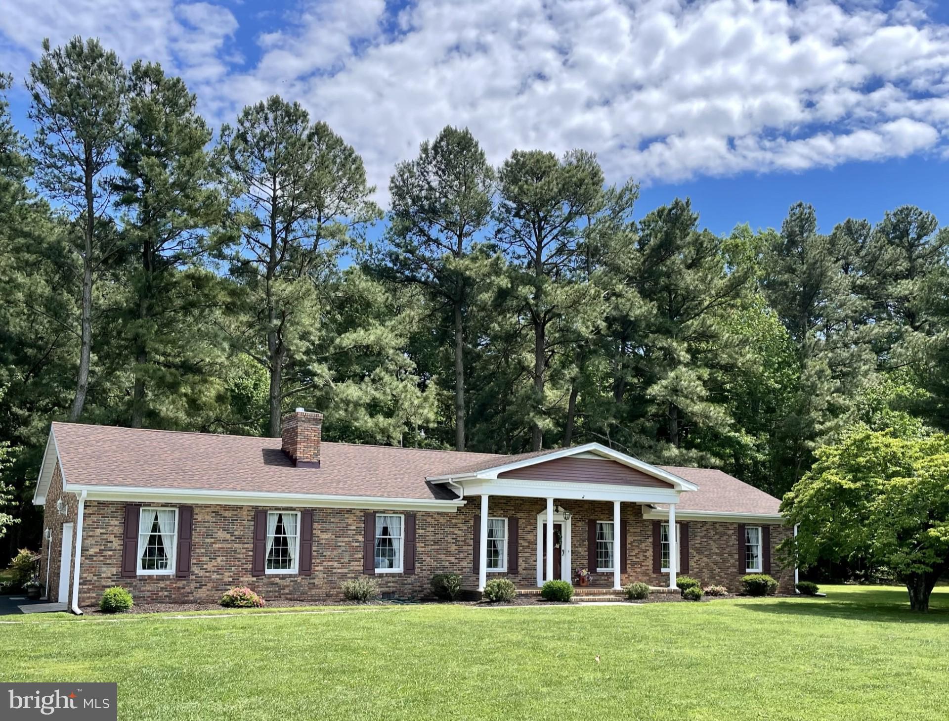 Rare opportunity to enjoy the best of town and country living in this lovingly cared-for home.  Curb appeal galore!  House sits on .92 acre corner lot just outside city limits.  Spacious home faces Magnolia-lined city park providing many beautiful and peaceful moments.  4Bedroom, 2 and 1/2 baths, with 2,332 square feet of living space plus an attached garage.  New roof in 2019.  Only one owner has occupied this home since construction.
Highlights:   Close to town, but outside city limits,  uniquely large corner lot, lifestyle lovely park view, and ample living space to adapt to your family's.   MUST SEE!