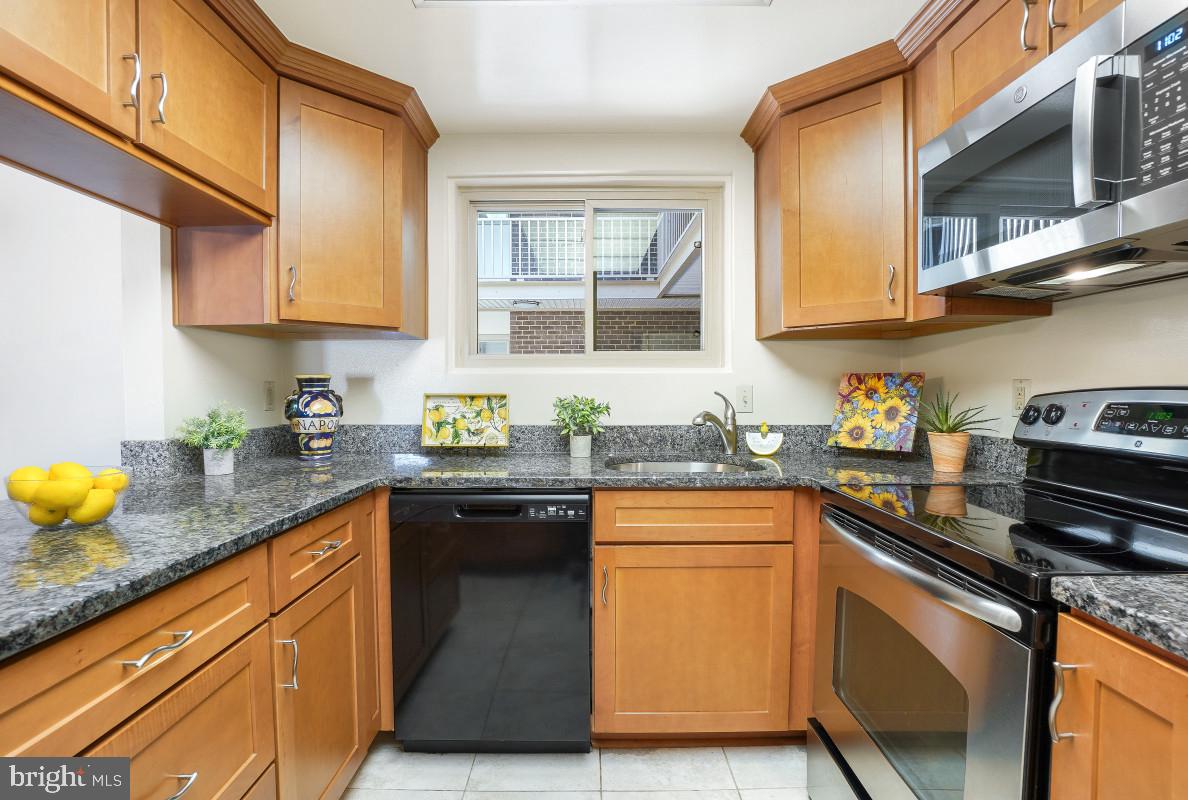 Experience resort-style living in this beautiful first-floor Montgomery Mutual Elizabeth model, ideally situated in a gated 55+ active adult community. The enclosed patio off the living room provides direct, step-free access to the parking area, offering exceptional convenience and accessibility. This spacious 2-bedroom, adjoined 1.5-bath home features a remodeled kitchen with granite countertops, soft-close drawers, abundant cabinetry, generous workspace, and a convenient pass-through to the dining room for easy entertaining.  Wood laminate flooring extends throughout the living room, dining room, and hallway. The bedrooms feature new carpeting. The bath has been updated with a step-in shower and has new vinyl flooring. Freshly painted, professionally cleaned, and move-in ready, the home also offers large, comfortable rooms, a full-size washer and dryer, abundant closet space, one assigned parking space, and an additional storage cage on the lower level. Ideally located near the community Broadwalk/walking trails, residents enjoy a maintenance-friendly lifestyle with a monthly fee that includes Co-op and HOA dues, utilities, basic cable TV, Wi-Fi, property taxes, and most unit maintenance. Exceptional community amenities include two clubhouses, a fitness center, indoor and outdoor swimming pools, tennis and pickleball courts, an 18-hole golf course, restaurants, game rooms, clubs, classes, and a wide variety of social activities. Surrounded by beautifully landscaped grounds, abundant green space, and scenic wildlife, this home offers the perfect combination of comfort, convenience, and active adult living. Come discover all that this wonderful community has to offer!