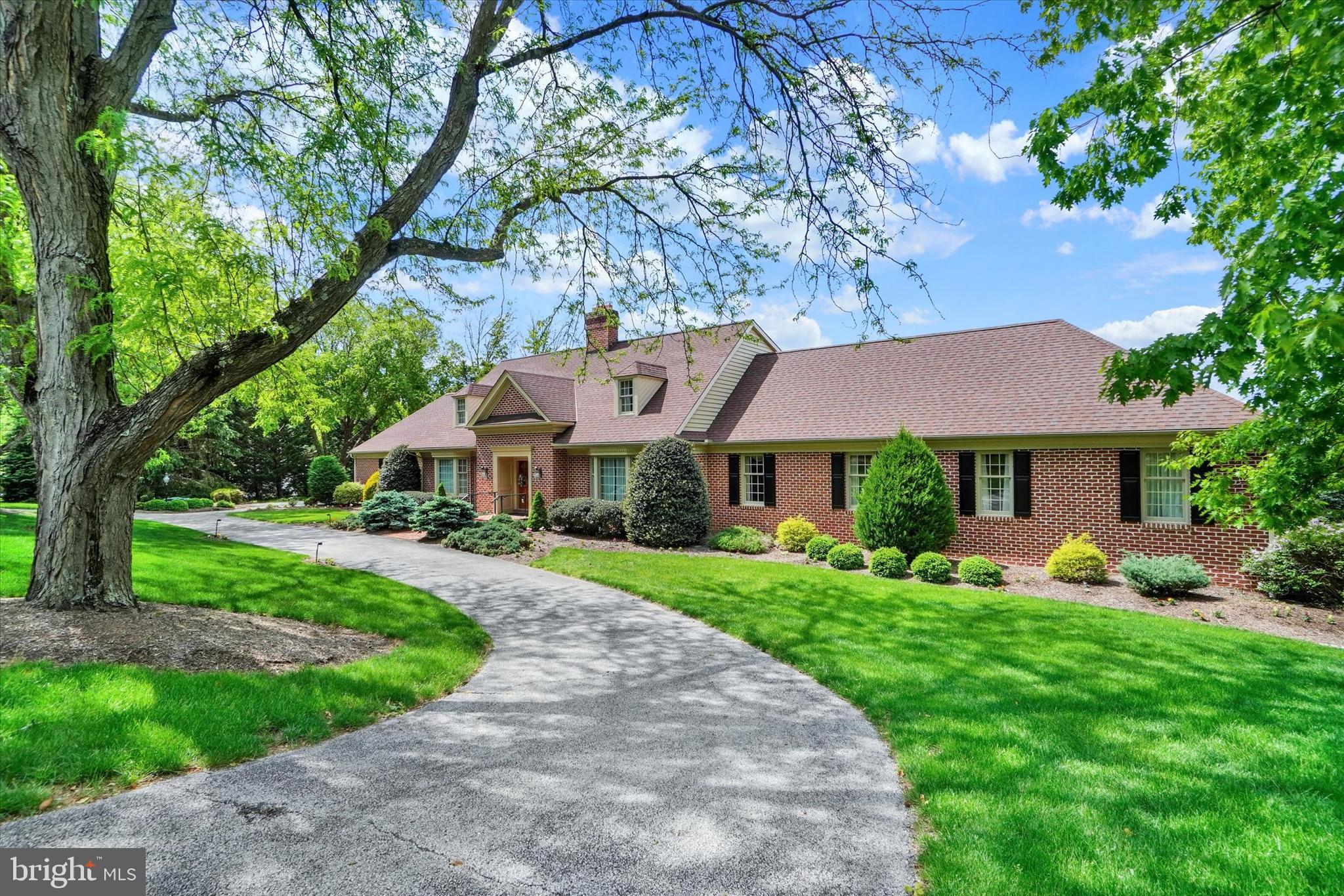 Experience a rare blend of timeless elegance, architectural presence, and exceptional scale in this magnificent all-brick custom estate, perfectly positioned in the prestigious golf course community of Wyndham Hills with sweeping panoramic views of the York City skyline. A grand marble-tiled foyer creates an unforgettable first impression, many custom details  and craftsmanship, from custom accent moldings and four statement fireplaces to an elegant butler’s pantry and an abundance of beautifully appointed gathering spaces designed for both grand entertaining and intimate everyday living.
The first-floor primary suite is a true private sanctuary, offering an extraordinary level of comfort with three full baths, multiple walk-in closets, a dedicated office, and a serene sitting or fitness area. An elevator provides seamless access to all levels of the home.
The second floor features five additional spacious bedrooms, including a remarkable private suite with its own office, balcony, and a dramatic wall of windows that captures breathtaking views and natural light.
Designed for year-round entertaining, the finished lower level offers an additional bedroom and bath, a stylish wet bar, craft room, fitness area, fireplace, and a spectacular four-season room complete with an indoor grill — creating the ultimate space for hosting in every season.
Additional highlights include multi-zone heating and cooling, an updated architectural shingle roof, and an unbeatable location just minutes from the renowned York Country Club for premier golf and social experiences. Enjoy quick access to the York Rail Trail for walking, running, or biking, vibrant downtown York dining and entertainment, WellSpan York Hospital, and I-83 for convenient commuting north or south into Maryland.
This is more than a home — it is a statement of lifestyle. A truly extraordinary property that must be experienced in person to fully appreciate its scale, design, and unmatched entertaining potential.