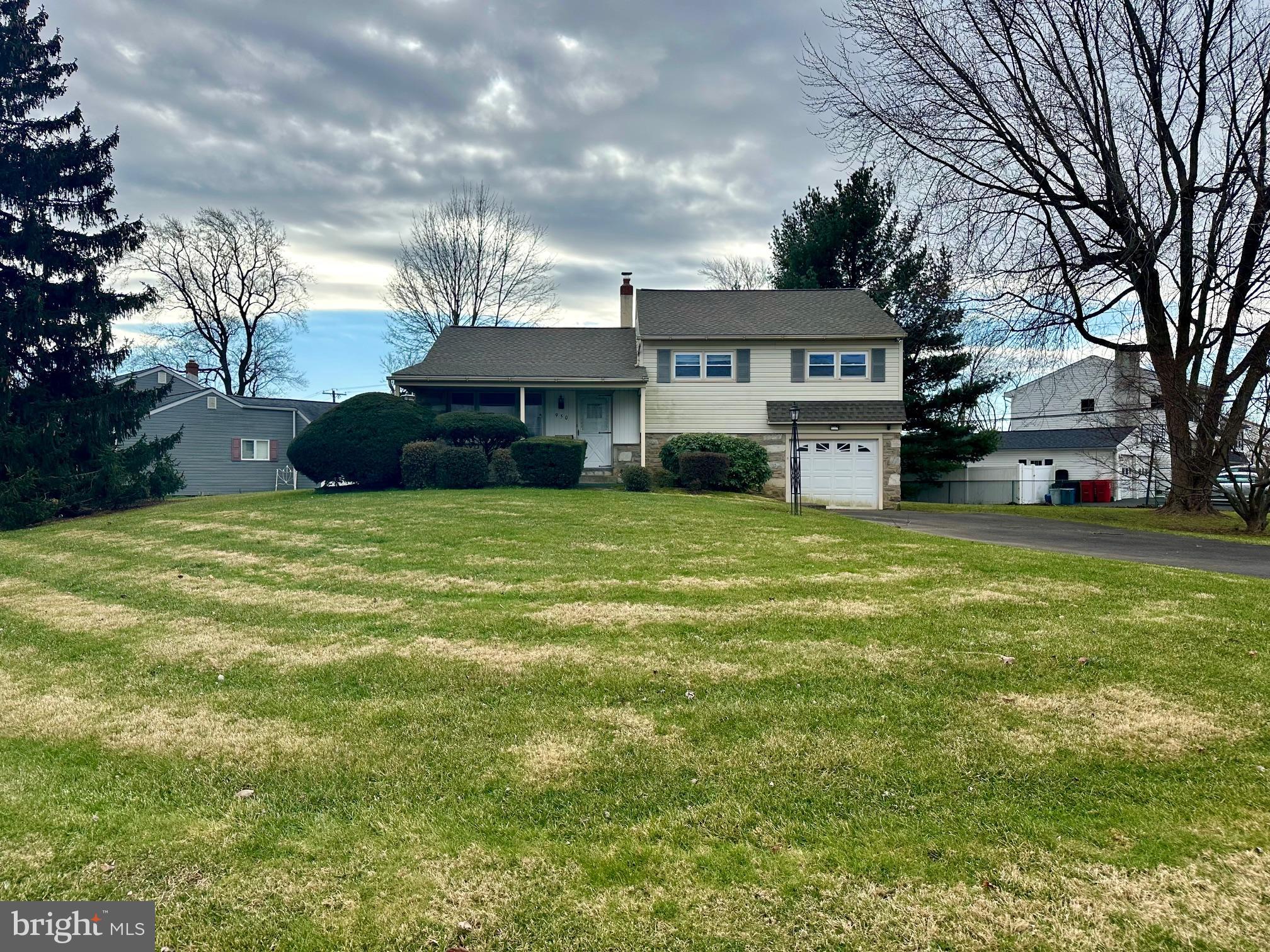 Situated on a large corner lot in Warminster, this stone split level home has a lot to offer.  The main level includes a living room, full dining room and eat-in kitchen.  Step down to the lower level which features a family room, powder room, laundry room and access to the attached one car garage. The primary bedroom with hardwood floors and full bath, two additional bedrooms and a full hall bath complete the upper level.  Desirably located, this home is convenient to township park, shopping, dining and major roads. Interior is in need of updating and is being sold "as is".