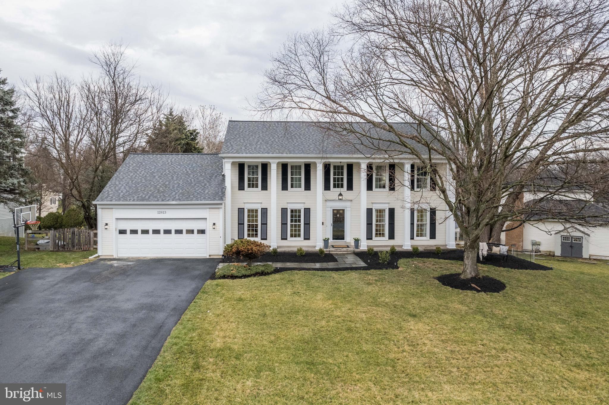 Welcome to this traditional four-bedroom TURNKEY, 3 1/2 bath home boasting luxurious finishes and ample space for comfortable living. Situated on a large landscaped lot, this turnkey property offers a perfect blend of sophistication and functionality.  Step inside to discover a center hall that sets the tone for the elegance found throughout the home. Gleaming hardwood floors (NEW) guide you through the open-concept main level, where natural light pours in through new (er) windows, illuminating the expansive living spaces and all new ligthing. The BRAND NEW gourmet kitchen, lighted glass custom cabinets, custom backsplash, wet bar is a chef's dream, featuring NEW stainless steel appliances, modern marble countertops, and a hightop with seating.  Adjacent to the kitchen, the spacious living room beckons with its cozy farmhouse style fireplace, creating a welcoming atmosphere for relaxation and entertainment with outside upper deck expanded and refinished. A formal dining room provides an elegant setting for special occasions and family dinners.  Main level office with French doors finished with recessed lighting, built ins and more. Primary suite complete with a large bathroom featuring a soaking tub, dual vanities, dual walk-in closets and glass-enclosed shower. Three additional  LARGE sun-filled bedrooms offer comfort and privacy for family members or guests, each appointed with NEW carpeting and ample closet space. The finished lower level adds versatility to the home, with a sprawling area perfect for movie nights, a home gym, or a playroom for children or a FIFTH bedroom.  Proper Egress window is supported in the large walkout with full bath, enormous separate storage, built in office area, recessed lighting, new carpet and more.  Outside, the expansive fenced backyard oasis awaits, offering a serene retreat with a BUTTERFLY garden, fire pit, separate seating area, a spacious patio area, and plenty of room for outdoor activities and entertaining. Conveniently located near schools, parks, shopping, and dining, this home provides easy access to all the amenities of modern living while offering a peaceful suburban retreat. 4200 sq ft of pure beauty and ready to call home. More updates and upgrades are listed inside of the home, including new roof, new HVAC, flagstone fire pit, expanded driveway, whole house fan and more. TWLIGHT open house Friday from 4:30-6:30 with refreshments and snacks. House shows even more lovelier in person...it is all in the details! Sellers may request a short rent back. *** KITCHEN wet bar shelves and pantry shelves to be installed Saturday.