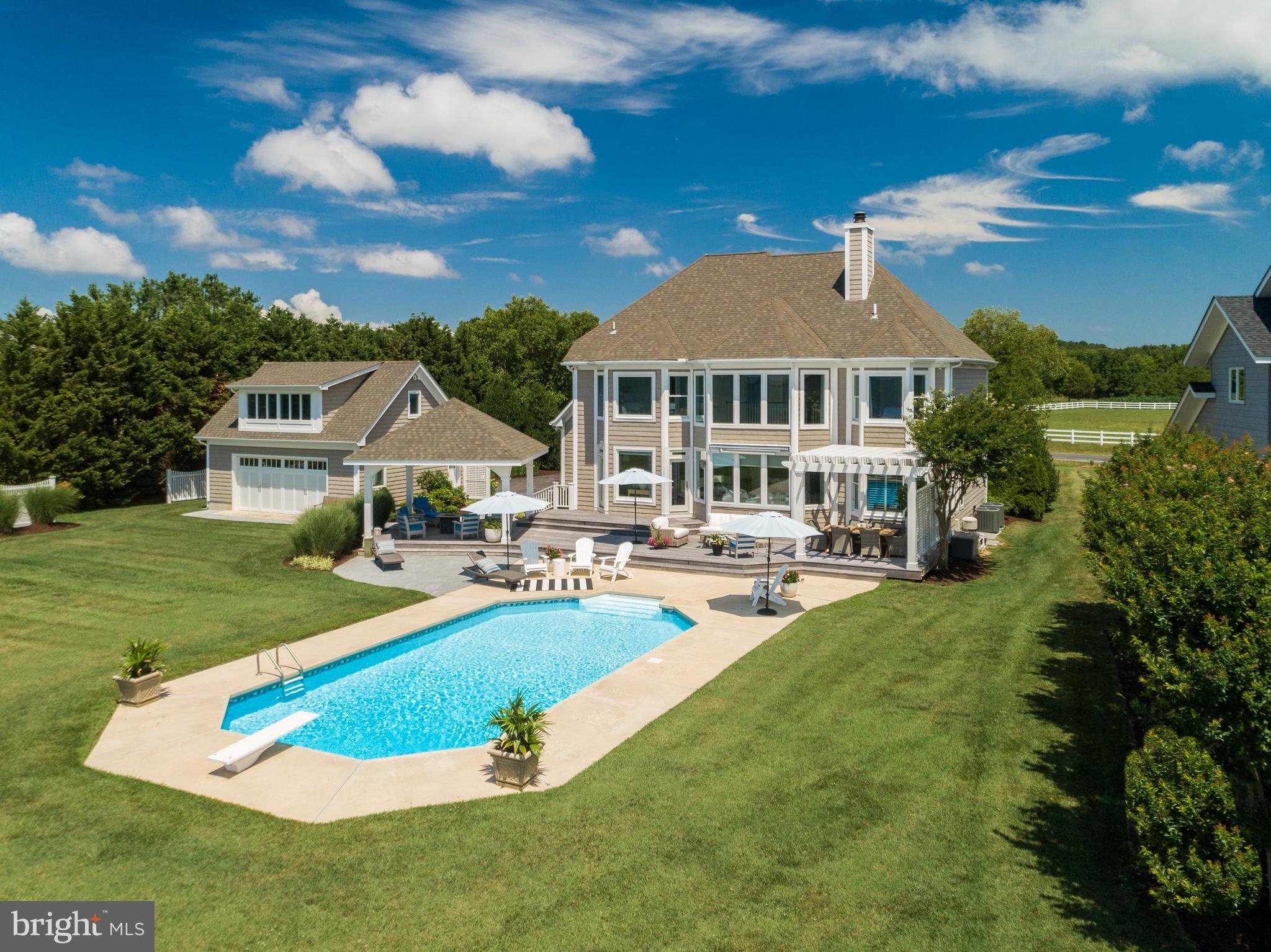 Stunning,  fully re-finished home waterfront  on Eastern Bay! Move in ready, spotless from top to bottom, nothing for you to do except enjoy the waterfront, fishing, water sports and much more. Entertaining will be delightful on the large over sized decks, and pergola areas. You can double your living space from spring to fall in the incredible out door space just imagine, sun light and the gentle breezes as you entertain in this tropical space. Beautifully finished with Hardwoods, Gourmet Kitchen,  all bathrooms  re-finished tiled baths and master bath  soaking tub maintenance free exterior, and  so many other up-grades!  New two car detached  garage  with room to be finished in above detached garage and a attached garage gives a lot of flex space to  pool & deck furniture and water toys. Central location on the island making a easy commute.