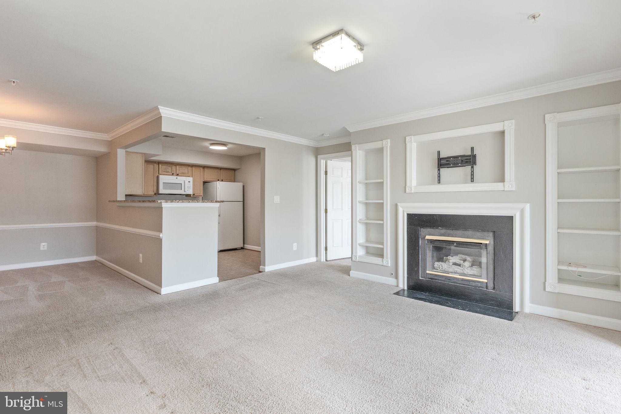 Entire condo has been freshly painted! Don't miss this 2 bedroom, 2 bath condo with spacious living room, separate dining area and balcony.  Neutral paint and carpet.  Entry hall leads to open floor plan to include the living room, dining area, kitchen, sunroom with access to balcony.  Laundry room is conveniently located near entry.  Large master bedroom has a walk-in closet and bathroom with double sink vanity and tub/shower.  2nd bedroom and hall bath located on other side of the unit.  Great location with close access to I95, Amtrak Station and the Springfield Metro.  Convenient to Fort Belvoir and Quantico.  Multiple retail and dining options at Springfield Town Center and Potomac Mills Mall.  Apply on the ROI Property Management website.