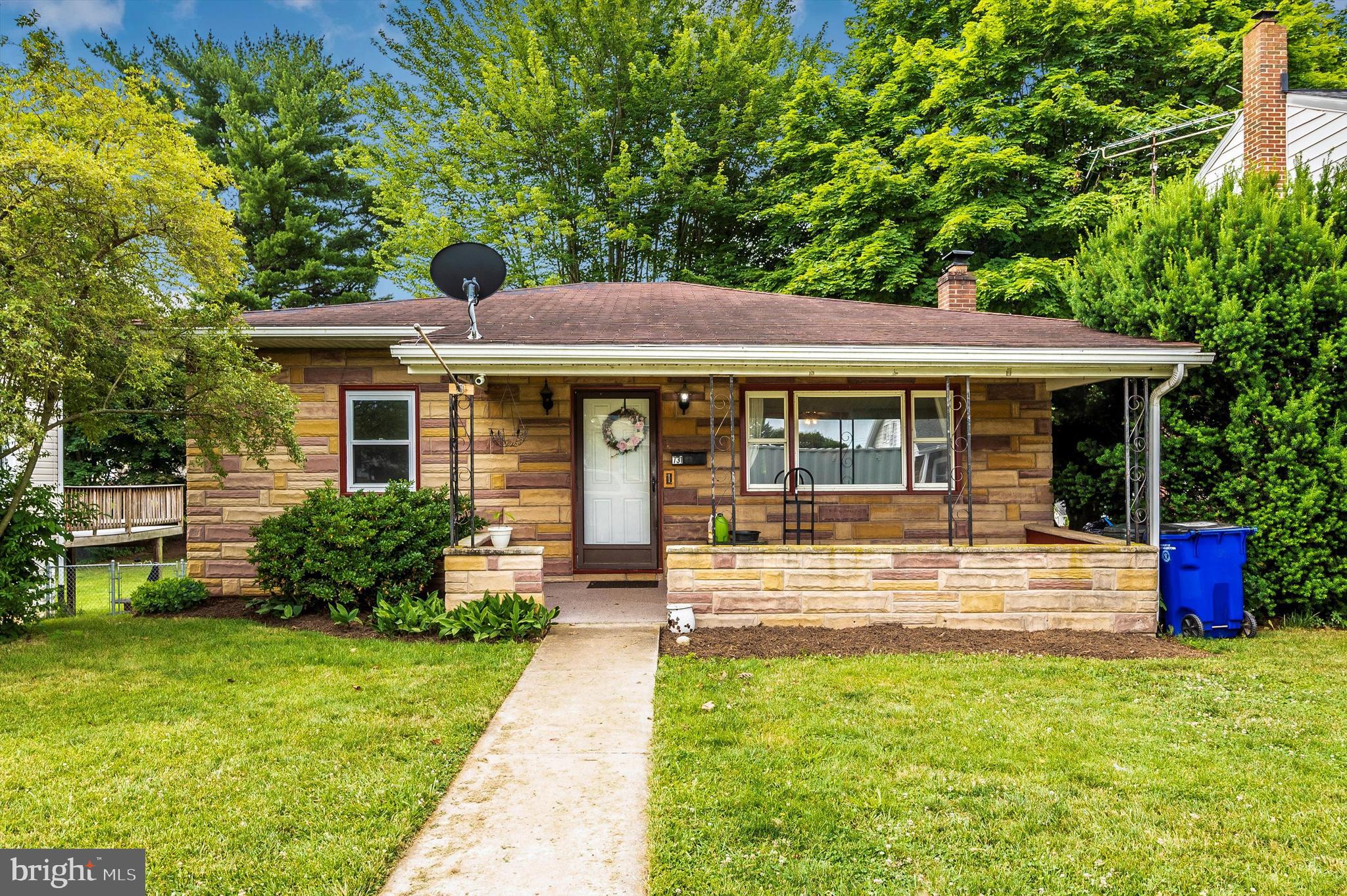 Back on the market! Their loss your gain! Move in ready!  This adorable 3 bedroom, 2 bath home features: new flooring throughout,  large updated kitchen with newer appliances, custom wood side counter (not included, but negotiable)  in kitchen and built-in custom shelves, large separate dining room, covered front porch, lower level family room with new wood bar and rec room area leading to rear patio, unfinished area in basement for storage and separate woodworking shop.  Additional bathroom in basement.  Separate laundry area.  Hardwood floors throughout the main level bedrooms.  Super cute backyard with ample space for entertaining!  City park is within walking distance.  (Playset is negotiable)
This is the perfect starter home!