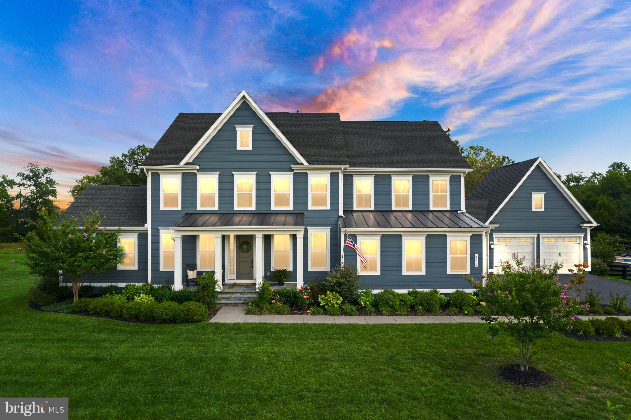 Coming Soon!  Stunning Home in Award-Winning Willowsford Community!  
Welcome to 25212 Lotus Pond Place, an exquisite residence nestled in the highly sought-after Greens of Willowsford. This spectacular 6-bedroom, 5.5-bathroom home boasts over 5,657 sq. ft. of luxurious living space on a beautifully landscaped .63-acre lot.  Ideal for multi-generational living, this property boasts a rare main level in-law suite and a spacious 4 car garage.
As you enter, you'll be greeted by a charming front porch that leads into an inviting foyer. The main-level in-law suite includes a cozy living room, a bedroom, and a full bathroom with a shower, providing comfort and privacy for family or guests. Adjacent to in-law suite, the lounge features stunning custom navy paint and an accent wall adding a touch of sophistication, creating a striking focal point.  
The heart of the home is the open eat-in kitchen, designed for both functionality and style. It features stunning white quartz countertops, stainless steel appliances, a double oven, gas cooktop, soft close kitchen cabinets and drawers, and a large island for gatherings. The butler's pantry and ample storage make entertaining a breeze. Adjacent to the kitchen, the family room boasts a warm gas fireplace creating an ideal space for relaxation and family time.  The main level features a spacious office with built-ins, perfect for remote work.  Easy access onto the deck from the office allows for some fresh air.
Upstairs, you’ll find 4 additional bedrooms, 3 full bathrooms, as well as a second laundry room for added convenience. Step into the luxurious primary suite, designed for ultimate comfort and elegance. Featuring two spacious walk-in closets, there's plenty of room for organization and storage. A cozy sitting area invites relaxation, perfect for unwinding with a book or enjoying morning coffee.  Experience the elegant bathroom featuring a stunning freestanding tub and a spacious walk-in shower with a rainfall showerhead. Two stylish vanities offer ample counter space, all illuminated by natural light and rich finishes, creating a serene personal retreat. Bedroom #2 features a convenient en-suite bathroom, providing both privacy and comfort. Bedroom #3 and bedroom #4 share a well-appointed Jack and Jill bathroom, perfect for families.  This thoughtful layout enhances both functionality and livability in the home.
Venture downstairs to find a finished basement that offers even more living space, complete with an additional bedroom and full bathroom—perfect for guests or as a private retreat.
Step outside to your fenced backyard oasis, featuring a covered deck that invites you to enjoy the serene surroundings. The spacious yard is perfect for outdoor activities, gardening, or simply unwinding after a long day.   
Enjoy the top-notch amenities of Willowsford—including The Lodge, Sycamore House, pools, parks, trails, ponds, lakes, dog parks, tot lots, zip line, farms, and farmstands—this home is a true gem.  Willowsford's beautiful Agrihood community sets itself apart from other neighborhoods with its' unique farm to table layout.  Willowsford's Kitchen is designed to provide a strong connection between residents and the farm.  Programs include adult cooking classes, resident dinners, culinary programs, kids cooking classes, wine tastings, pop-up restaurant nights.  Willowsford boasts a wide range of clubs and social groups.  Children have to opportunity to be a part of the Willowsford Waves summer swim team.  The community events include 4th of July Fireworks, Fall Festivals, and more.  Don’t miss the opportunity to make this stunning property yours! Schedule a showing today and experience the lifestyle that Willowsford has to offer!
Updates: New LVP on entire upper level, Armstrong Hickory 7" plank on main floor, Board and Batten throughout, Finished custom pantry in kitchen, New dishwasher, New Sump Pump, Wireless security system, Fresh paint, Irrigation system.