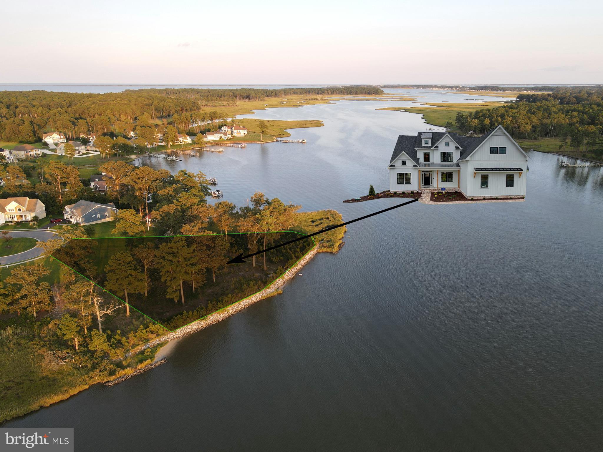 Premier waterfront 1.15 acre lot-home package with panoramic views of beautiful Herring Creek. This is a rare opportunity to build a beautiful new home by the 2023 Delaware Home Builder of the Year, Capstone Homes! The award winning Hannah model by Capstone Homes boasts 5 bedrooms and 3.5 bathrooms. Located on a private cul-de-sac, this point lot has more than 200 feet of rip-rapped shoreline and offers many unique possibilities.  Ability to install a boat dock/lift and a private pool if desired. Direct boat access to Rehoboth Bay and Atlantic Ocean.  High elevation lot. Enjoy spectacular sunsets over the water from the back of the house.  This lot is located in the community of Bay Pointe, which has a variety of amenities including a community pool, clubhouse, fitness center,  large waterfront gazebo, kayak racks and pier. Close to tax-free shopping, golf, restuarants and the beach.