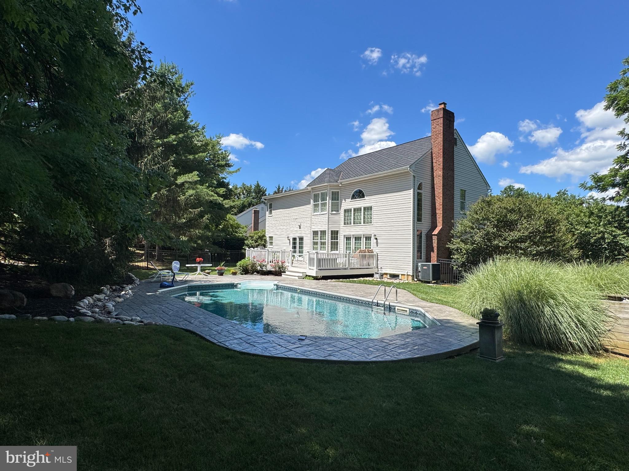 This beautifully landscaped and well-maintained Clark Turner home is located in the highly sought-after neighborhood of Sable Woods. The main level features a formal living and dining area, as well as a spacious two-story family room with a charming wood-burning fireplace and French doors that open onto a large deck. You will love the updated kitchen, which includes cherry cabinets, a Sub-Zero refrigerator, an induction cooktop, a double wall oven with a microwave, granite countertops, and a large island with an overhang for stools, along with a pantry for extra storage.
On the second level, you'll find a stunning primary bedroom complete with a spacious and updated spa bath and plantation shutters.Additionally, there are three more bedrooms and a modern hall bathroom on this level.
The finished lower level includes a family room with French doors that lead to a large stairway, allowing for extra natural light from the side yard. This area also features double doors leading to a roomy office/gym space, a full bathroom, and extra storage.
This summer, you'll have the perfect venue for entertaining family and friends with your large maintenance-free deck, patio, and inground pool. Enjoy the privacy and beautiful landscaping, which provides vibrant colors throughout each season. Numerous updates have been made throughout this lovely home, including new carpet in the lower level, kitchen, second-floor hall bath, and primary bath. The roof was replaced in 2025, and the HVAC system was updated in 2014. In the past couple of years, the pool liner, filter, salt system, cover, and all electrical switches and outlets have been replaced.
This beautiful home is available now and ready for you to enjoy your summer by the pool! Don’t delay—schedule your appointment today!