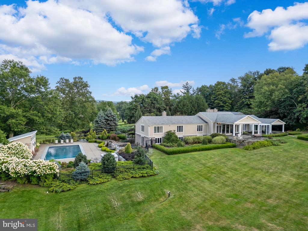 Indulge in the epitome of luxury living at 495 N Abington Rd, Waverly Township's most exclusive estate. Spanning over 4,340 square feet of masterfully crafted living space, this palatial 5-bedroom, 4 full and 2 half bath residence is set amidst 5.48 acres of pristine landscape, offering unparalleled privacy and tranquility. The estate’s exterior is a haven of sophistication, featuring a resort-style inground pool, a refined pool house, and an expansive 6-car garage, perfect for the discerning collector. Inside, the home exudes timeless elegance with its gleaming hardwood floors, a grand living room bathed in natural light from expansive windows, and a meticulously designed layout that seamlessly blends comfort with opulence. A state-of-the-art safe room adds an extra layer of security to this magnificent property. This is more than just a home; it’s a lifestyle, where every detail has been considered for those who demand the very best. Experience unparalleled grandeur at 495 N Abington Rd.