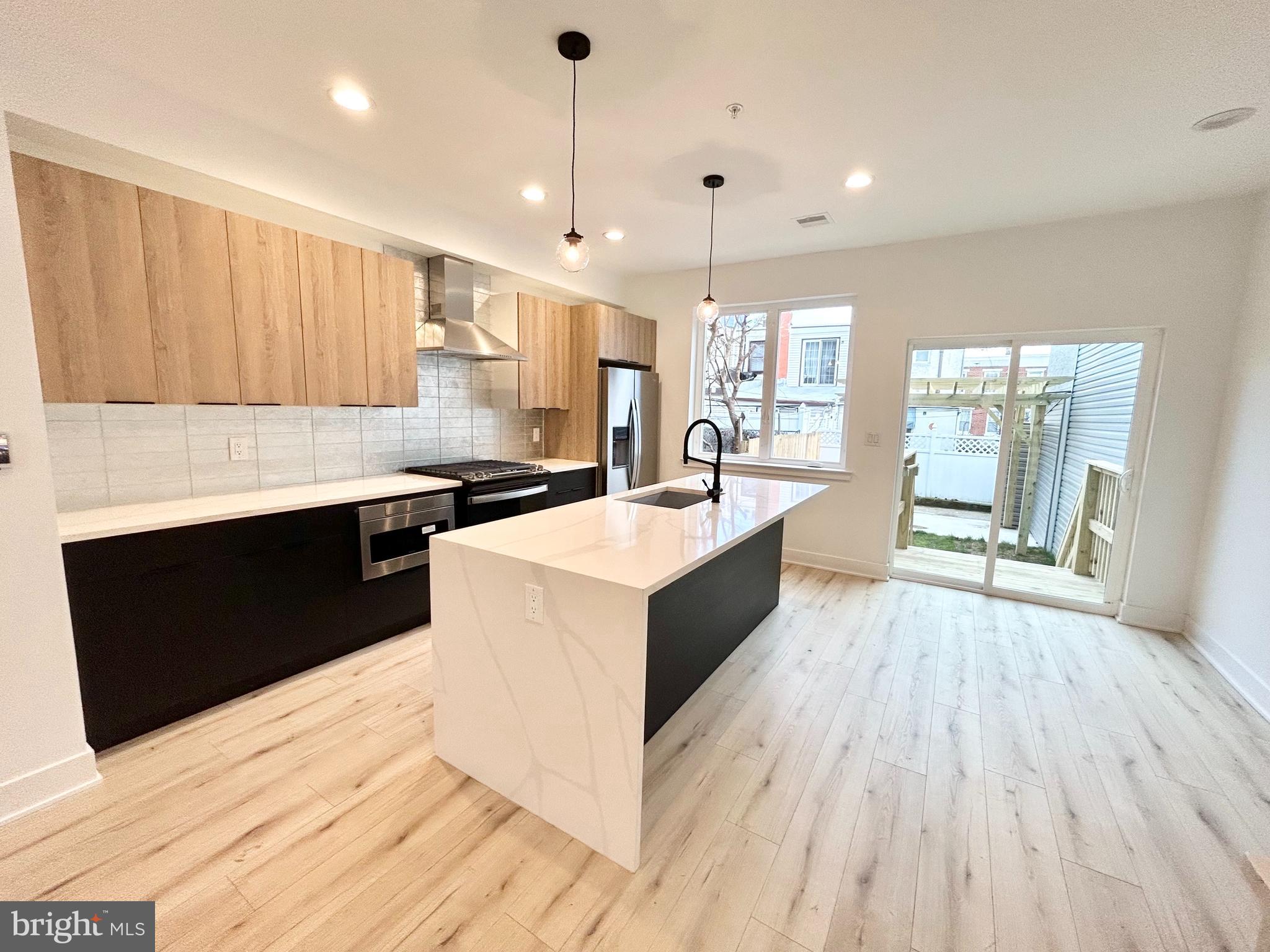 Live at 2343 E York St, a luxurious newly constructed home with immaculate flourishes at every corner. This home is extremely spacious, boasting 4 bedrooms, 3 bathrooms, a gourmet kitchen, spa style bathroom, a bar area, a finished basement, a rooftop, and a huge backyard space. The living area is big bright and airy. The kitchen features tons of cabinet and cooking space. windows are oversize and allow for great views of Fishtown and tons of natural light. This home is truly an urban oasis and has plenty of possibilities on how to utilize its large floorplan. Tour today!