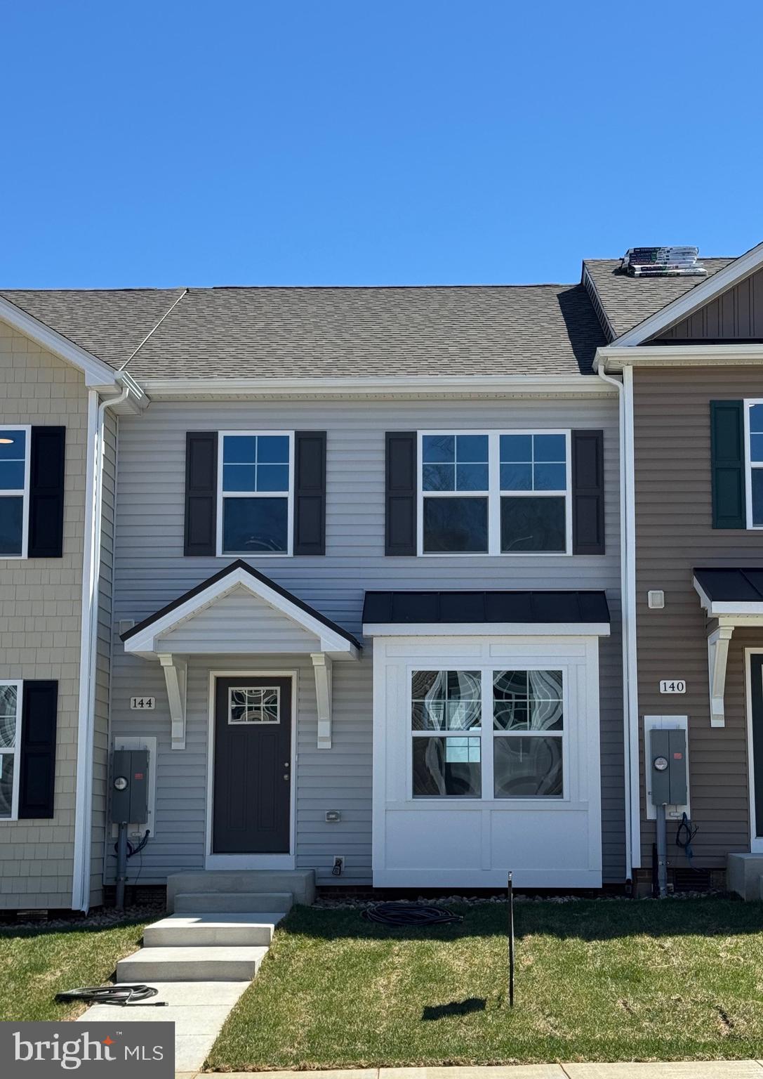 To Be Built, Spring Delivery  Everything you want, already built in.  These 2-level townhomes offer 1,440 sq. ft. of thoughtfully designed living space featuring 3 bedrooms and 2.5 baths.  The open main level welcomes you with luxury vinyl plank flooring, a spacious family room with bump-out, and a beautiful kitchen complete with granite countertops, a large island, separate breakfast bar, pantry, and stainless steel appliances—perfect for everyday living or entertaining.  Upstairs, the primary suite impresses with a vaulted ceiling, walk-in closet, and bath featuring a tile shower with glass door and double vanity. Two additional bedrooms and a full hall bath provide plenty of space for family, guests, or a home office.  Overflow parking is just steps away. The builder is also offering closing cost assistance!  Ideally located just minutes from I-81, shopping, grocery stores, and restaurants, The Communities of Burwell offers the perfect blend of modern comfort and everyday convenience.
