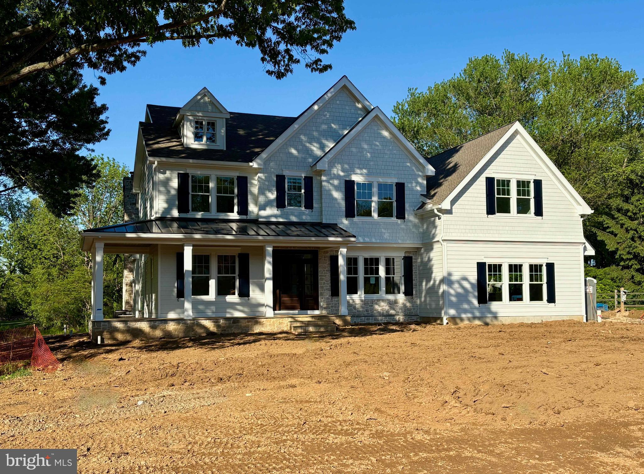 Welcome to 1017 Waltham Road, an exceptional new construction estate by Top Notch Custom Homes, perfectly situated on a picturesque 1.1-acre lot in the heart of Easttown Township. Offering over 5,000 square feet of thoughtfully designed above-grade living space, this stunning home blends timeless craftsmanship with elevated modern luxury.  Designed for both everyday living and elegant entertaining, the home features five spacious bedrooms, five full and two half bathrooms, dual laundry rooms, 10-foot ceilings on the main level, and 9-foot ceilings on the second floor. A partially finished walk-up basement with a full bath provides flexible additional living space, while the three-car side-entry garage offers ample storage and everyday convenience.  Exceptional finishes and architectural details can be found throughout, including a custom mahogany front entry door, site-finished hardwood flooring, Andersen windows, Hardie Plank siding, thin-cut stone veneer, and designer plumbing and lighting fixtures. The gourmet kitchen is appointed with premium Wolf, Sub-Zero, and Cove appliances, marble countertops, and thoughtfully designed custom cabinetry.  Additional highlights include built-in cubbies, custom closet systems, composite shutters, and beautifully curated finishes throughout. Outdoor living is equally impressive, featuring a welcoming wraparound flagstone front porch and a covered rear porch complete with a wood-burning fireplace and dramatic full-height stone chimney — the perfect setting for year-round entertaining.  Ideally located near major commuting routes, upscale shopping and dining, Aronimink Golf Club, Waynesborough Country Club, and The Episcopal Academy, this home is also within the award-winning Tredyffrin/Easttown School District.  Listing agent is a member of the LLC selling the property. Taxes reflect land value only and the property will be reassessed after settlement.  Professional photos will be added.