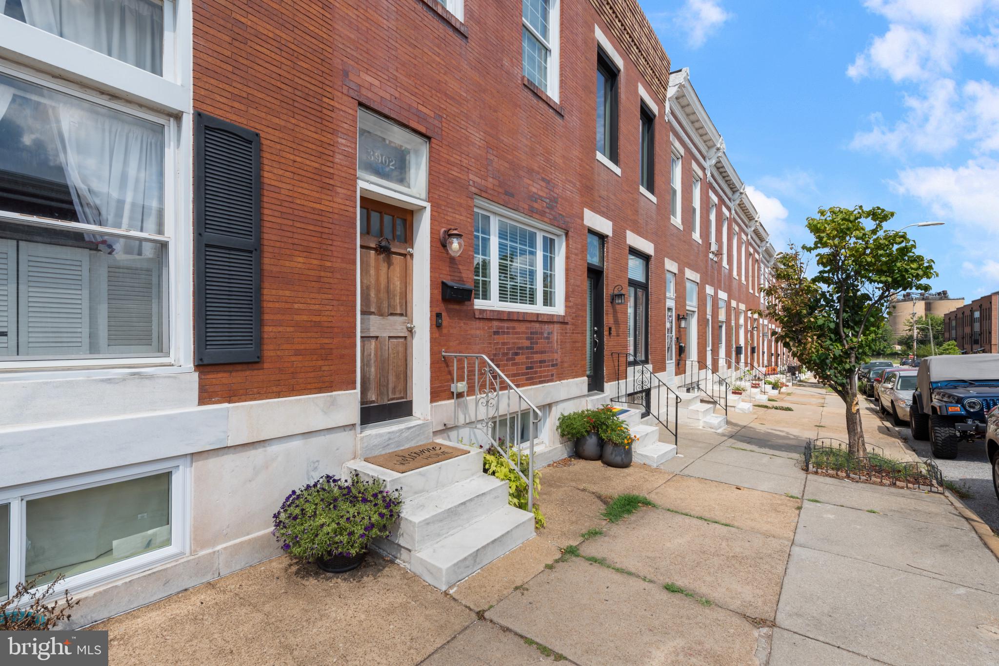 This 3 bedroom, 2.5 bath in the heart of Brewers Hill home features an open floor plan with gleaming hardwood floors, recessed lighting, and charming exposed brick walls. The modern kitchen boasts 42" cabinets, stainless steel appliances, granite countertops, and a convenient breakfast bar. Retreat to the primary suite, complete with tray ceilings, recessed lights, and a beautifully tiled shower. The second bedroom offers access to a cozy rear porch. Enjoy additional space in the full basement, which includes a bonus room perfect for storage. With popular restaurants and shops just a few blocks away, you'll love the convenience and vibrant lifestyle this location offers.