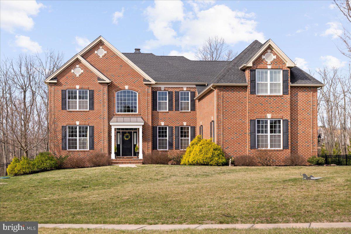 Welcome to this exquisitely detailed move in ready home in beautiful Bucks County. This meticulously maintained home is a rare gem, combining timeless elegance with modern convenience. As you step into the grand two-story foyer, the impressive front staircase and custom millwork set the tone for sophistication throughout the home. To your right, the formal dining room, illuminated by two stunning chandeliers, provides a perfect space for memorable dinners. A butler’s pantry offers additional space for your entertaining needs. To the left, enjoy quiet time in the beautifully appointed living room. The great room is very well proportioned, with its soaring wood beamed ceilings and gas fireplace. It’s the perfect spot to relax with family and friends. Just off the great room you will find a private office/study offering a quiet retreat. The well-designed kitchen is a chef’s delight, equipped with abundant counter space, custom cabinetry/tilework, and custom walk-in pantry. Upstairs, enjoy 9’ ceilings. The grand primary suite serves as a serene sanctuary, featuring a comfortable den, four walk-in closets with custom closet systems, and a large ensuite bath. The upstairs is completed by an ensuite bedroom and two additional generously sized bedrooms with a Jack and Jill bath.  Don’t forget to take the well-placed back stairs to the kitchen. The unfinished basement presents endless possibilities for customization. Outside, enjoy the beautifully landscaped grounds from the blue stone patio, complete with a relaxing hot tub. The property backs up to conserved land, offering peace, privacy, and beautiful views. Additional features include gorgeous solid hickory floors, plantation shutters, and a three-car garage with additional storage space. 60 minutes by car or take a nearby train to Philadelphia. 15 minutes to the heart of the lovely Doylestown Borough, 5 minutes to Lake Galena, and just over 2 hours to NYC.
First time offered for sale, schedule your private showing today and experience everything this remarkable property has to offer!