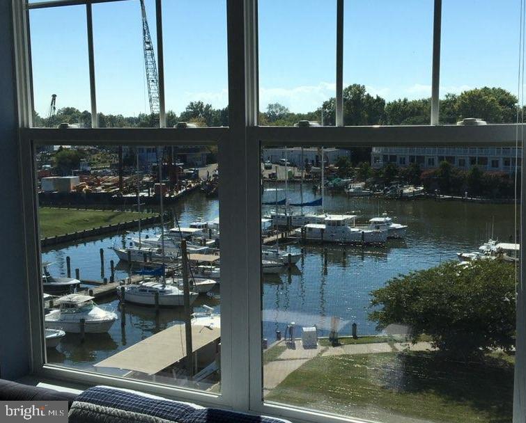 First time on the market! This beautiful well maintained 2-bedroom, 2 bath condo in Deep Harbor is a true delight. This unit offers a spacious kitchen large enough for a breakfast table and has an adjoining laundry room. Large separate dining room to entertain family and friends. Living room with balcony overlooking Cambridge Creek and city amenities. Large primary bedroom with water views. Second bedroom with adjoining bath. Unit includes storage unit in parking garage. Gated community and locked lobby. Enjoy the community pool on those hot summer days. This unit is the original owners, and they have enjoyed it from day one. Walking distance to downtown restaurants, shopping and the new Cambridge Harbor waterfront development. This unit is a must see.