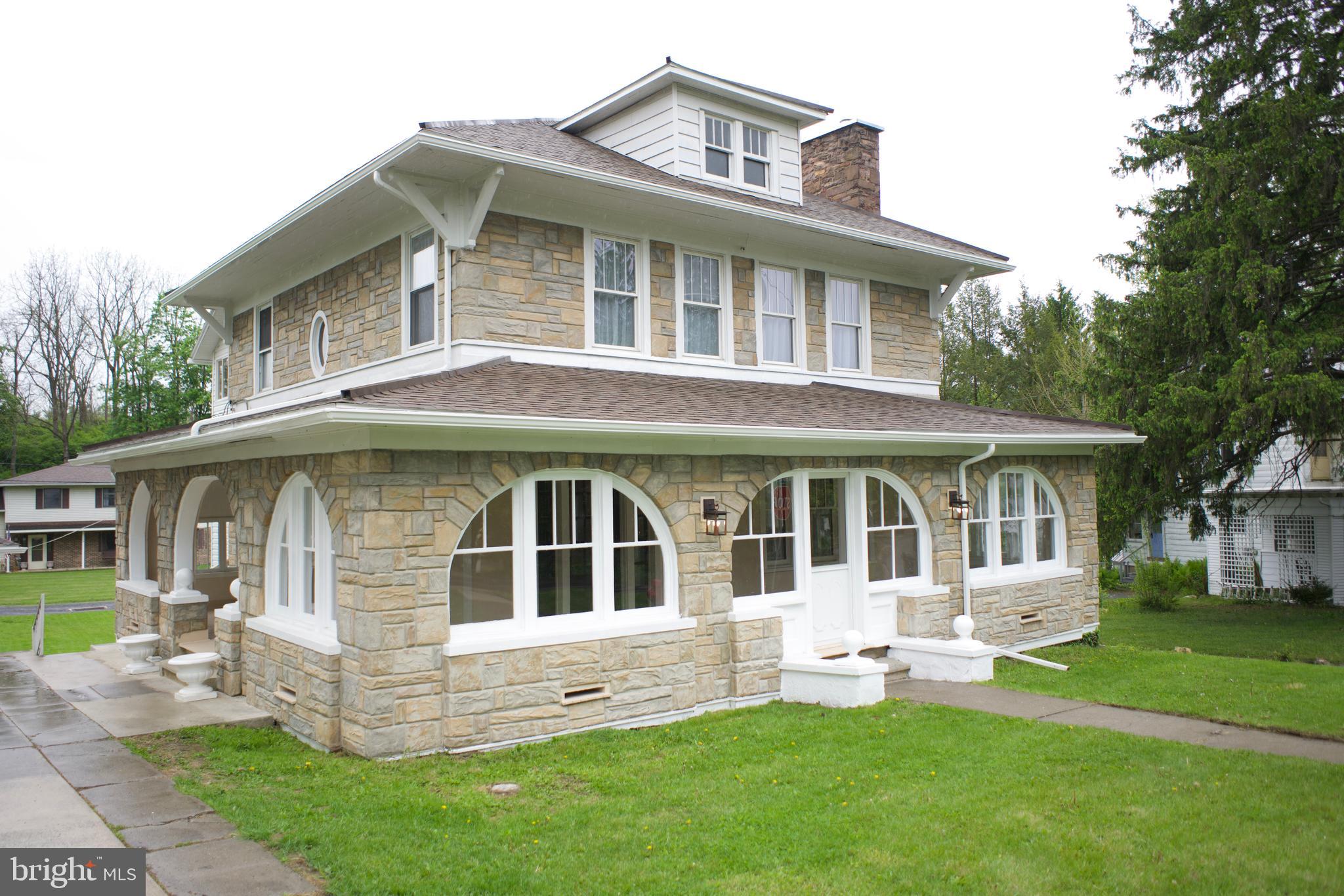 Step into a piece of history, beautifully brought to life. This stunning 1925 home has been thoughtfully and completely remodeled from top to bottom, seamlessly blending vintage character with modern comfort. Inside, you'll find high ceilings, original woodwork, and original doors that speak to the craftsmanship of another era, all preserved and lovingly maintained. Original hardwood floors have been refinished to perfection, and gorgeous built-ins add both function and warmth throughout. Four generous bedrooms offer wonderful flexibility, with great closet space throughout that's truly rare in a home of this era. The brand-new kitchen is a showstopper--fresh, functional, and ready for everything from weeknight dinners to weekend gatherings. Two full baths, also fully updated, round out the interior with style and convenience. Step outside and enjoy not one but two covered patios, perfect for morning coffee or evening entertaining no matter the weather. Parking is a breeze with a private driveway and additional access off Breon Alley. All of this in an unbeatable location, just a short stroll to downtown Millheim, two libraries, and the soon-to-be remodeled Millheim Pool. Bright, warm, and full of soul, this home is truly one of a kind.