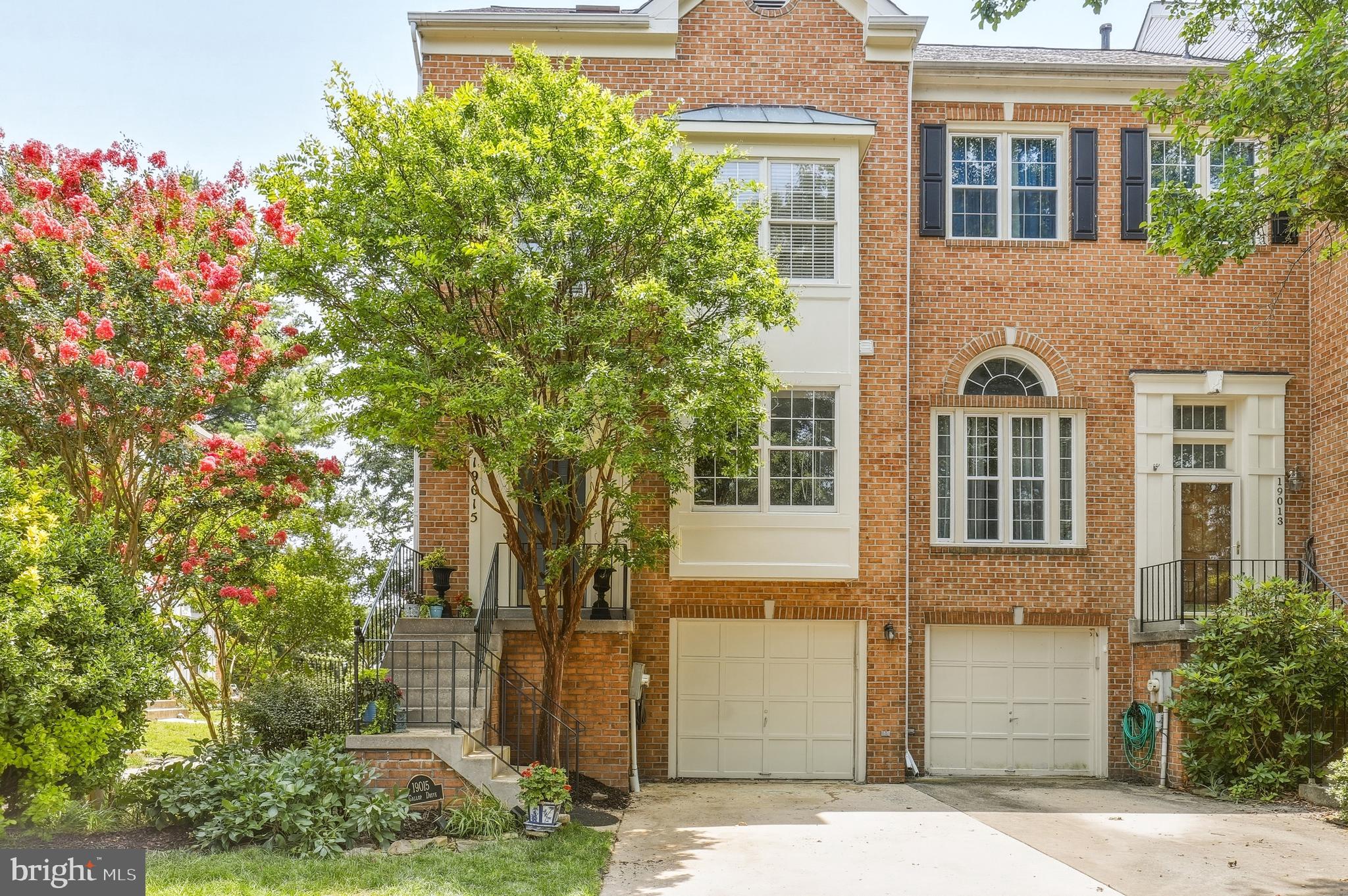 Located in the desirable Germantown Estates, this 3-bed, 2-full bath, 2-half bath brick-front, End Unit townhome offers almost  2,000 sq ft of living space, a one-car garage, plus a rear deck and fully fenced rear yard, backing to trees! Step into gleaming hardwood floors, crown molding, and a bright, open, and freshly painted main level with soaring ceilings and a woodburning fireplace in the spacious living/dining room with french doors to the rear deck. The updated kitchen boasts new, grey, ceiling-height cabinets, stainless steel appliances and quartz counters, wood flooring, recessed lighting, and a charming bump out window breakfast nook.  A conveniently placed powder room completes this level. Upstairs are two generously sized bedrooms, freshly painted and each with new LVP flooring, and sharing a full hall bath with tile flooring, and a tub/shower combo. The top floor is dedicated to the private owner’s retreat—an expansive suite offering vaulted ceilings, more new LVP flooring, and a peaceful area to unwind. The en-suite bathroom impresses with a dual-sink vanity, walk-in shower, separate soaking tub, skylights, and a large walk-in closet. The walkout lower level adds even more living space with brand-new carpet, a second powder room, laundry room, storage room, and a spacious recreation room with woodburning fireplace, and sliding door leading to the private, and fully fenced rear yard. Additional highlights include a large attached one-car garage, and recent upgrades such as new sod front and back, 8 new windows, fresh paint throughout, new light fixtures, and combination wood, new carpet, and new LVP flooring . Enjoy access to Manchester Farm amenities including a pool, tennis courts, soccer fields, multiple playgrounds, and nearby Leaman Park. Just minutes away, South Germantown Recreation Park offers even more with a splash pad, driving range, miniature golf, and the Maryland SoccerPlex. Germantown Town Center with Safeway, Starbucks, public library, dining, and more is located nearby. DON’T MISS OUT ON THIS RARE FIND!