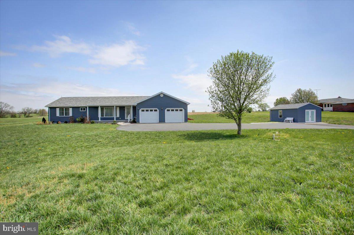 Welcome to your dream home, a charming rancher nestled in the serene countryside with stunning mountain views. Built just a few years ago, this house combines modern comforts with the tranquility of rural living.
As you step into the front living room, you're greeted by a large bay window that frames the picturesque mountain scenery, inviting you to relax and enjoy the view. The house features two spacious bedrooms, but there's also a cozy den that could easily be transformed into a third bedroom, offering flexibility for your needs.
The hardwood floors throughout the home add warmth and elegance, leading you to the heart of the house—the modern kitchen. Equipped with quartz countertops, a stove, microwave, dishwasher, and refrigerator!  A kitchen island with bar stools and a lazy susan are also included! The kitchen offers a beautiful view of the farm fields in the backyard, making meal preparation a delightful experience. The stove is versatile, allowing you to choose between gas or electric cooking.
The primary bedroom is a true retreat, boasting a huge walk-in closet and an ensuite bathroom designed for comfort and accessibility. The bathroom features a handicap accessible shower with a bench and grab bars, ensuring safety and convenience.
The second bedroom is very spacious and features large windows with beautiful views, lots of natural light, and a large closet!
There is also a laundry room conveniently located on the first floor and equipped with a washing machine, clothes dryer, sink, and storage closet. 
Storage is abundant throughout the home, with ample space to keep everything organized. The basement is a standout feature, with 9' ceilings, poured walls, a water filtration system with UV light and aeration, and a high-efficiency water heater. There is also a radon mitigation system already in place! 
Outside, the front porch is made of concrete and features a stone walkway leading to the front door, adding to the home's curb appeal. The expansive back deck, constructed from Trex decking, is perfect for outdoor entertaining and enjoying the beautiful surroundings.
The property includes an attached 2-car garage and an additional shed! The shed features French Doors and three large windows with 50-amp service, making it perfect for a Hobby/Shop. Spanning over 1.25+/- acres, the land is beautifully landscaped and easy to maintain.
For peace of mind, the house is equipped with a whole-house generator, surge protector, and buried electric lines from the pole to the house, ensuring reliable power and protection. Starlink connectivity is already in place for ease of access with internet service! 
This home is a perfect blend of country charm and modern convenience, offering a peaceful retreat with all the amenities you need. Close to Whitetail Ski Resort and Golfing! Don't miss the opportunity to make this beautiful rancher your own!