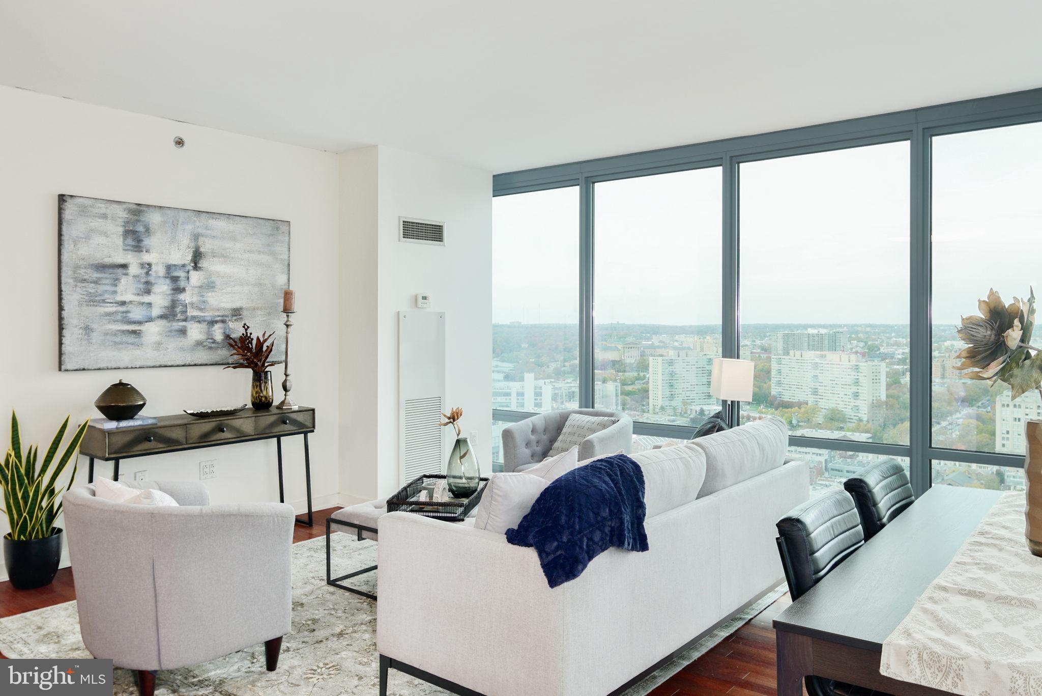 Welcome to Residence 3307 at Murano, a rare opportunity to own an exceptional north-facing condominium in one of Center City Philadelphia’s premier luxury high-rise communities. This spacious 876 square foot residence offers a highly sought-after layout featuring expansive floor-to-ceiling windows that flood the home with natural light while showcasing breathtaking skyline and city views.

The thoughtfully designed open-concept floor plan seamlessly connects the living, dining, and kitchen areas, creating the perfect setting for both everyday living and entertaining. Rich hardwood flooring, modern finishes, and generous ceiling heights complement the sophisticated urban lifestyle that Murano is known for. The oversized living area offers incredible flexibility for furniture placement and design, while the spacious kitchen provides ample cabinetry, granite countertops, and stainless steel appliances.

The primary bedroom suite offers excellent closet space and large windows that continue the impressive north-facing exposure throughout the home. The well-appointed bathroom features contemporary finishes and functionality. Included with the sale is one assigned parking space and one private storage locker, providing exceptional convenience and value rarely found in Center City living.

Residents of Murano enjoy a full-service luxury lifestyle with 24-hour concierge service, a state-of-the-art fitness center, heated indoor pool, sun deck, resident lounge, and secure garage parking. Perfectly positioned in the heart of Center City, Murano offers immediate access to Rittenhouse Square, the Schuylkill River Trail, Trader Joe’s, 30th Street Station, University City, fine dining, shopping, and some of Philadelphia’s best cultural destinations.

Experience luxury condominium living at its finest in this beautifully designed residence now available at Murano.

Please note: Photos shown are example photos of the exact same layout from a different but very similar floor/unit.