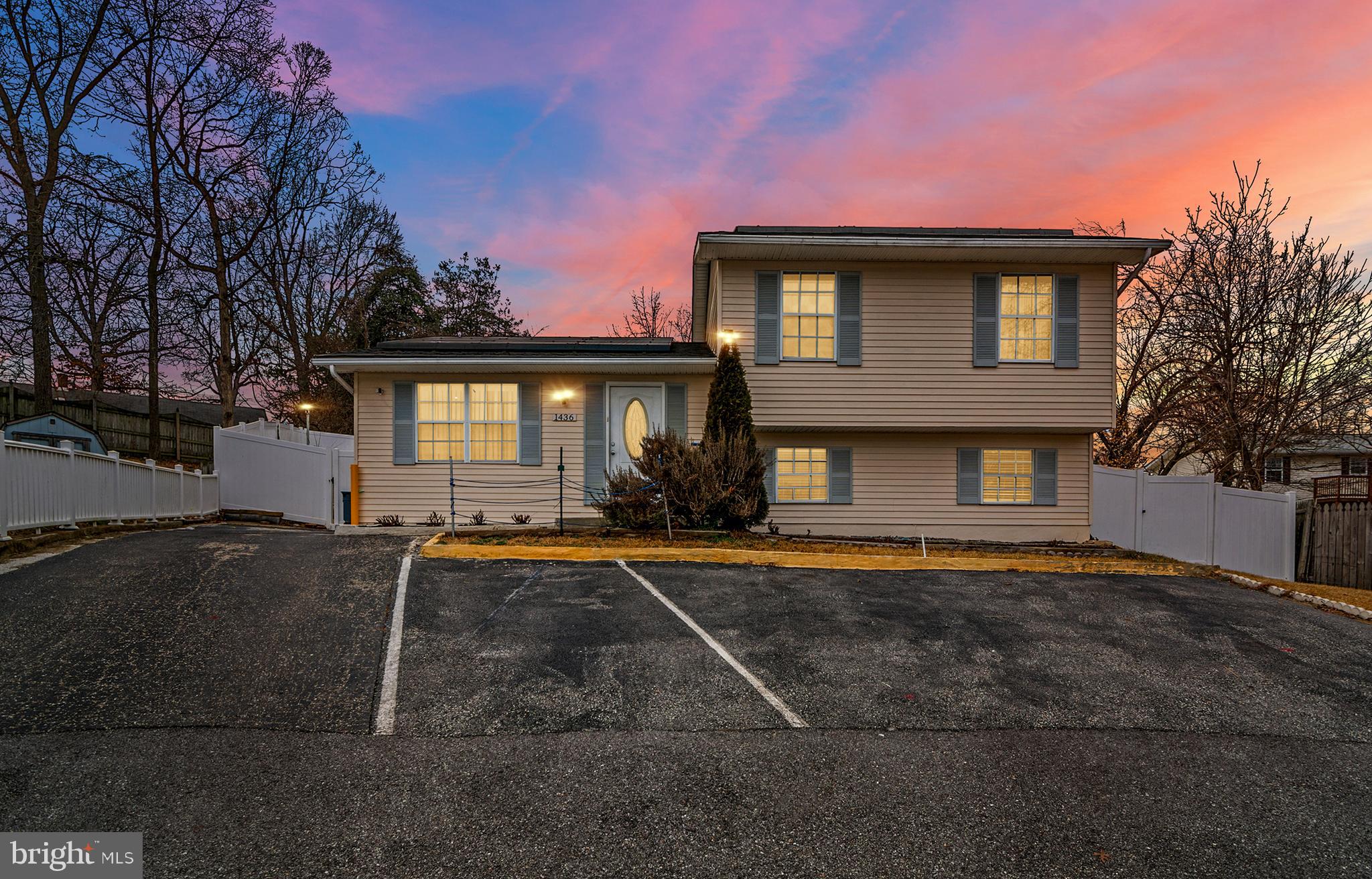 **Open House - Saturday & Sunday, March 14/15th, 12-2 pm** Versatility meets comfort in this well-maintained 4-bedroom, 3-bath split-foyer home in the Knightsbridge community of Annapolis. Offering approximately 1,560 square feet of above-grade living space plus a finished lower level, the layout provides flexibility for a variety of living arrangements.
The main level features three bedrooms and two full bathrooms, including a primary suite with its own private bath. The kitchen and dining area provide a comfortable space for everyday living and entertaining, complemented by French doors and stainless steel appliances and energy-efficient double-pane windows that bring in natural light.
The finished lower level adds an additional  560sqft of valuable living space with a private rear entrance, a fourth bedroom, a full bathroom, a den or office, and a second kitchen—ideal for extended living, guests, or flexible use of space.
Step outside to enjoy the covered back deck overlooking a private backyard with fruit-producing trees, including three apple trees, a pear tree, and two peach trees. A walking path runs along the entire perimeter of the yard, creating a peaceful outdoor setting. Additional features include a 12x14 storage shed, ample off-street parking, solar panels , and a brand-new HVAC system installed in 2025.
Conveniently located just minutes from downtown Annapolis, shopping, dining, parks, and major commuter routes.