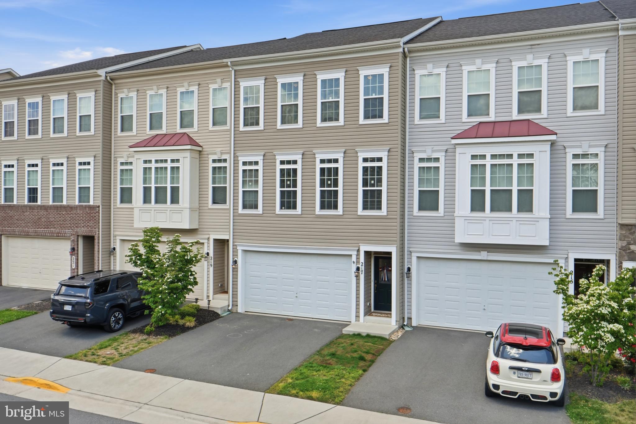 OPEN HOUSE SUNDAY JUNE 14th 1-4PM
Beautiful, bright, and sun-filled home featuring the largest floor plan in the community with over 2,600 square feet of thoughtfully designed living space. This exceptional home showcases numerous quality builder upgrades throughout, including all wood and luxury vinyl plank flooring (no carpet anywhere), upgraded kitchen appliance package, quartz countertops, enhanced cabinetry, designer lighting, upgraded ceramic tile, luxurious primary bath finishes, and elegant Craftsman-style trim, doors, and moldings.

Recent improvements include a brand-new deck, new dishwasher, and new washer and dryer, providing both style and convenience for the next owner. The fully finished lower level offers a private en-suite bedroom, perfect for guests, multigenerational living, or a home office. An oversized garage provides ample storage and parking space.

Move-in ready and meticulously maintained, this home combines modern upgrades, functional living spaces, and abundant natural light throughout. Please remove shoes when touring the home.