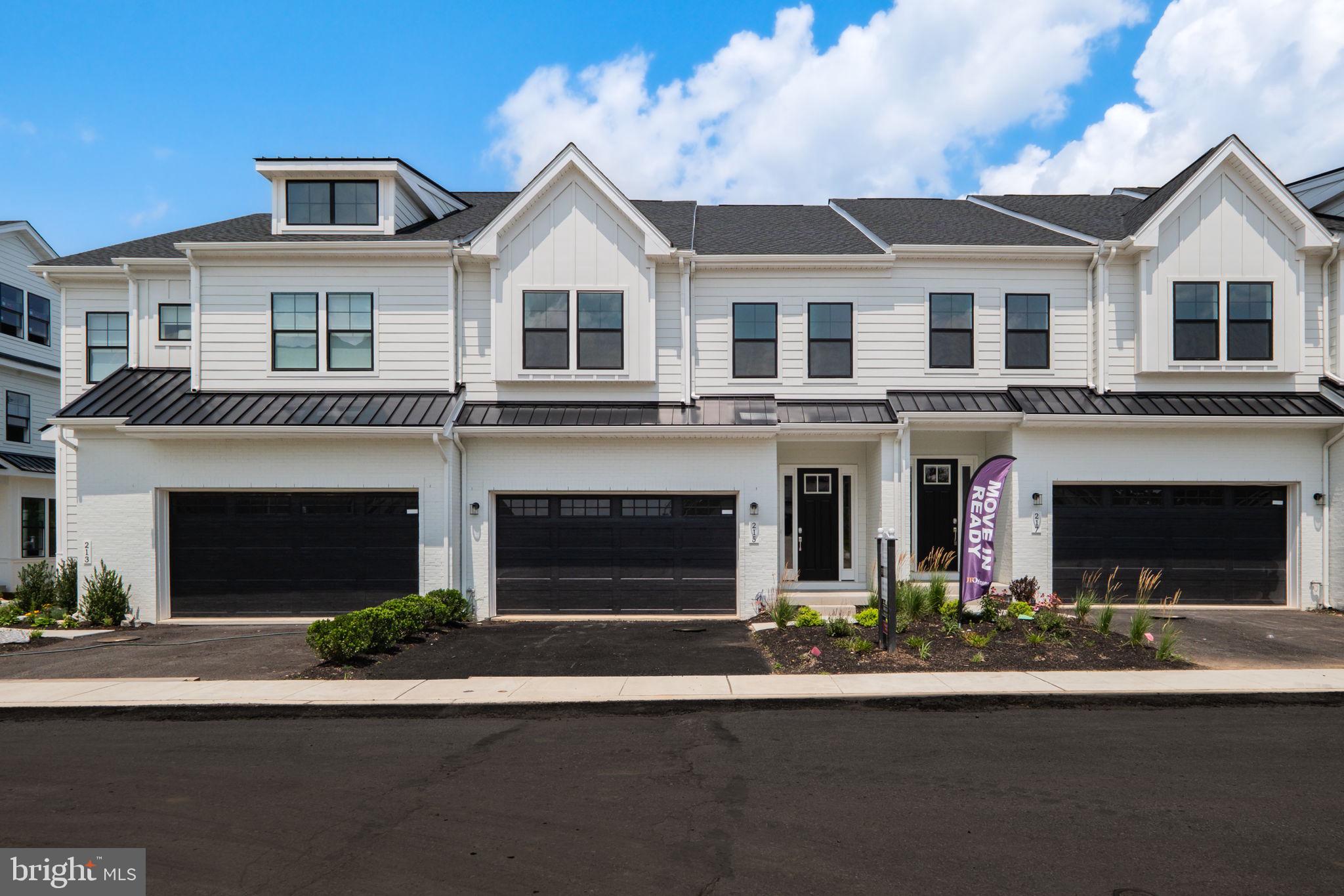 This quick move-in Harper Grand offers more than 3,000 square feet of beautifully finished living space, with three bedrooms, two-and-a-half baths, a two-car garage, and a finished walk-out basement. Elevated finishes, generous proportions, and a highly livable floor plan come together to create a home that feels both sophisticated and effortless. A welcoming foyer opens to the heart of the home, where 10-foot ceilings and an open-concept design connect the kitchen, dining area, and great room in one seamless living space. The kitchen is a true focal point, featuring ceiling-height cabinetry in a refined organic-modern palette, soft-close doors and drawers, a large center island, and a walk-in pantry. A 36-inch gas cooktop sits beneath a custom wood hood, adding architectural character while anchoring the room with warmth and style. The great room is filled with natural light from oversized windows that frame peaceful views of mature greenery beyond. That sense of privacy continues outdoors to the 10-by-20-foot deck, creating an easy extension of the main living area for morning coffee, quiet evenings, or relaxed entertaining. A dedicated first-floor study adds valuable flexibility, offering a private space for working from home, reading, or stepping away from the activity of the open living areas. Upstairs, a spacious loft creates a natural gathering point between three bedrooms and a conveniently located laundry room. The owner’s suite is privately positioned at the rear of the home and features two walk-in closets and a spa-inspired bath with a dual vanity, walk-in shower, and private water closet. Both secondary bedrooms also include walk-in closets and share a well-appointed hall bath with dual sinks, an elevated detail that sets this home apart from typical new construction. The finished walk-out basement adds another level of versatility, ideal for a media room, fitness space, playroom, guest area, or additional entertaining space. Set within the vibrant River Trail community, this home offers the best of both worlds: natural surroundings, modern comfort, and everyday convenience. With quick access to major highways, you are just minutes from where you need to be while still coming home to a setting that feels private, peaceful, and connected to nature.