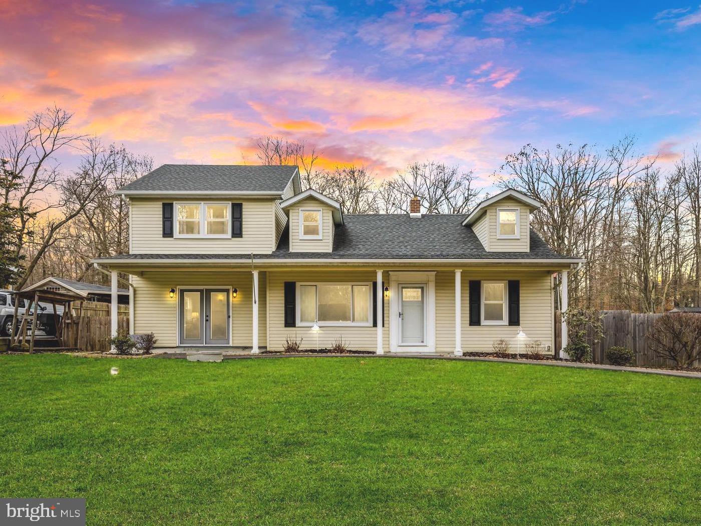 Experience the epitome of Havre De Grace living in this meticulously updated single-family home, nestled on a coveted .51-acre flat lot. The property exudes charm, with its expansive covered porch welcoming you into a haven of tasteful finishes. Step inside to discover a front sitting room and an oversized family room featuring a wood-burning stove, creating a cozy ambiance. The kitchen has been thoughtfully modernized with white cabinetry, granite countertops, and stainless steel appliances enhanced by additional removable built-ins, perfect for accommodating both your family and four-legged friends. The kitchen seamlessly opens to the formal dining space, providing access to the covered back deck—ideal for outdoor gatherings. Down the hall, you'll find two bedrooms and a full bathroom. Venture upstairs to discover three more bedrooms and an additional full bathroom. The primary bedroom offers ample space, presenting an opportunity for the addition of another bathroom and/or closet. Outside, the backyard transforms into a true oasis, enclosed by a large wooden privacy fence. Enjoy the charm of a cozy fire pit area, an additional entertaining space, and two sheds with electricity— one equipped with both heat and a concrete slab. Parking is effortless with the extended driveway accommodating up to eight cars. For practicality, the crawl space serves as a temperature-controlled storage solution. Recent upgrades include roof (2016), HVAC (2016), wood stove (2017), bedroom and living room fans (2019), wood privacy fence (2019), windows and front door (2020), yard fire pit area (2021), sump pump (2021), tankless water heater (2023), deck storm door and awning (2023), carpet and paint (2023), and more. Welcome home!