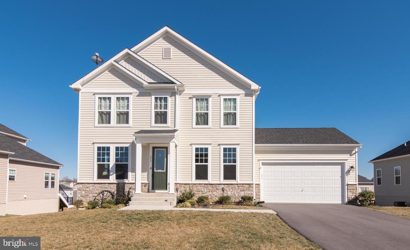 Three levels bump out to spread out in this "STUNNING" colonial home with easy access to commuter routes! Stone front home has a great mix of formal and informal spaces to make entertaining and everyday living easy. From the impressive entry, hardwood flooring continues through the sun filled first level. Spacious family room with a fantastic wall of windows and a stacked stone fireplace flows into the expanded gourmet kitchen featuring granite countertops, stainless appliances and pantry. Enjoy your meals from sitting at the island, breakfast area or your formal dining room. Upper level offers 4 bedrooms and 3 full baths.  Luxurious primary bedroom with tray ceilings, sitting area, walk-in closet and full bath. The bath offers shower, two separate vanities, water closet and linen closet. The additional bedrooms are nicely sized with two of them sharing a Jack and Jill bath and the fourth bedroom having its own bath (perfect for a visiting guest). Laundry room is conveniently located just outside the bedrooms. Fully finished basement includes a recreation area, a fifth bedroom, full bathroom, an exercise room and a storage area.  2 car garage, rear composite deck and a nicely landscaped .24+- acre. Close to shopping, schools and parks. Ideal for commuters!  **Enjoy the community pool with these hot summer days!
