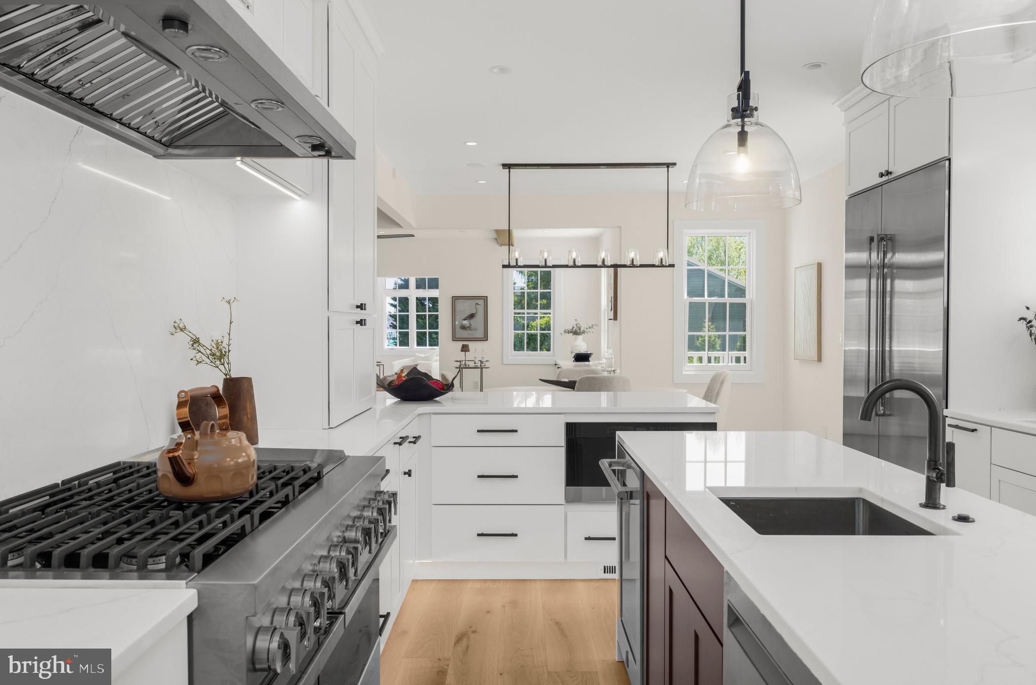 Perfectly positioned along the waterfront in the prestigious Murray Hill neighborhood of Annapolis, this extraordinary estate represents a rare opportunity to own a fully reimagined luxury residence where privacy, walkability, boating lifestyle, and architectural sophistication converge in one of the East Coast’s most coveted waterfront settings.  RenownedBohan Contracting has been extensively renovating the home since October 2025. The home has not been lived in since completion, offering an exceptionally rare “like-new” experience where every finish, appliance, system, and curated detail remains untouched. Set on an unusually expansive waterfront lot for downtown Annapolis standards, the property delivers a sense of scale and privacy that is nearly impossible to replicate within Murray Hill. Mature landscaping, multiple outdoor living spaces, Brazilian Ipe decking, and panoramic water views create a setting that feels worlds away while remaining just moments from the energy and charm of downtown Annapolis. Designed for the discerning buyer seeking a refined waterfront retreat, the residence effortlessly balances elevated entertaining with relaxed coastal living. Whether arriving by boat after a day on the Chesapeake Bay, hosting sunset gatherings overlooking Spa Creek, or enjoying peaceful mornings watching sailboats drift by, the home was designed around an experience. Inside, timeless design and modern luxury unfold at every turn. The fully reimagined chef’s kitchen rivals those found in premier custom estates, anchored by a complete JennAir Noir appliance suite including a 48-inch dual-fuel range with double ovens, professional refrigeration, dual integrated dishwashers, multiple beverage centers, built-in ice maker, and a butler's pantry designed as both a prep and entertaining space. Custom Schrock “Trademark” maple cabinetry, designer-selected Waterworks fixtures, Calacatta Miraggio Cielo quartz with dramatic waterfall detailing, and layered architectural lighting elevate the space into a true showpiece. Throughout the residence, every finish was intentionally selected to create warmth, sophistication, and understated luxury. Wide-plank white oak flooring, custom white oak ceiling beams, Restoration Hardware lighting, Baldwin hardware, integrated Sonos audio throughout the home, Lutron lighting controls, custom plaster fireplaces, upgraded insulation for sound attenuation, and CAT6 wiring provide the seamless blend of craftsmanship and modern infrastructure expected at this caliber of home. The primary suite serves as a private sanctuary, complete with custom built-ins, boutique-style California Closets systems, integrated laundry, and a bespoke fireplace designed to create an atmosphere reminiscent of a luxury waterfront hotel suite. Every secondary space continues the same level of thoughtful execution and design continuity rarely achieved in residential renovations. Outside, the waterfront experience becomes truly exceptional. A private pier with electric, boat lift,  paver stone extended driveway, refinished gates, and oversized outdoor entertaining areas creates a lifestyle tailored for effortless luxury. The property’s unique positioning offers both protected water access and breathtaking views while maintaining an uncommon sense of seclusion in the heart of Annapolis. Located just minutes from Downtown Annapolis, the United States Naval Academy, award-winning restaurants, yacht clubs, boutique shopping, and private aviation access, this home is ideally suited for the executive or entrepreneur seeking an uncompromising second home or primary waterfront residence within easy reach of Washington D.C., Northern Virginia, Philadelphia, and New York. The ability to enjoy a true luxury waterfront lifestyle with boating access, walkability, privacy, and substantial land all within one of Annapolis’ most prestigious neighborhoods is extraordinarily rare.
